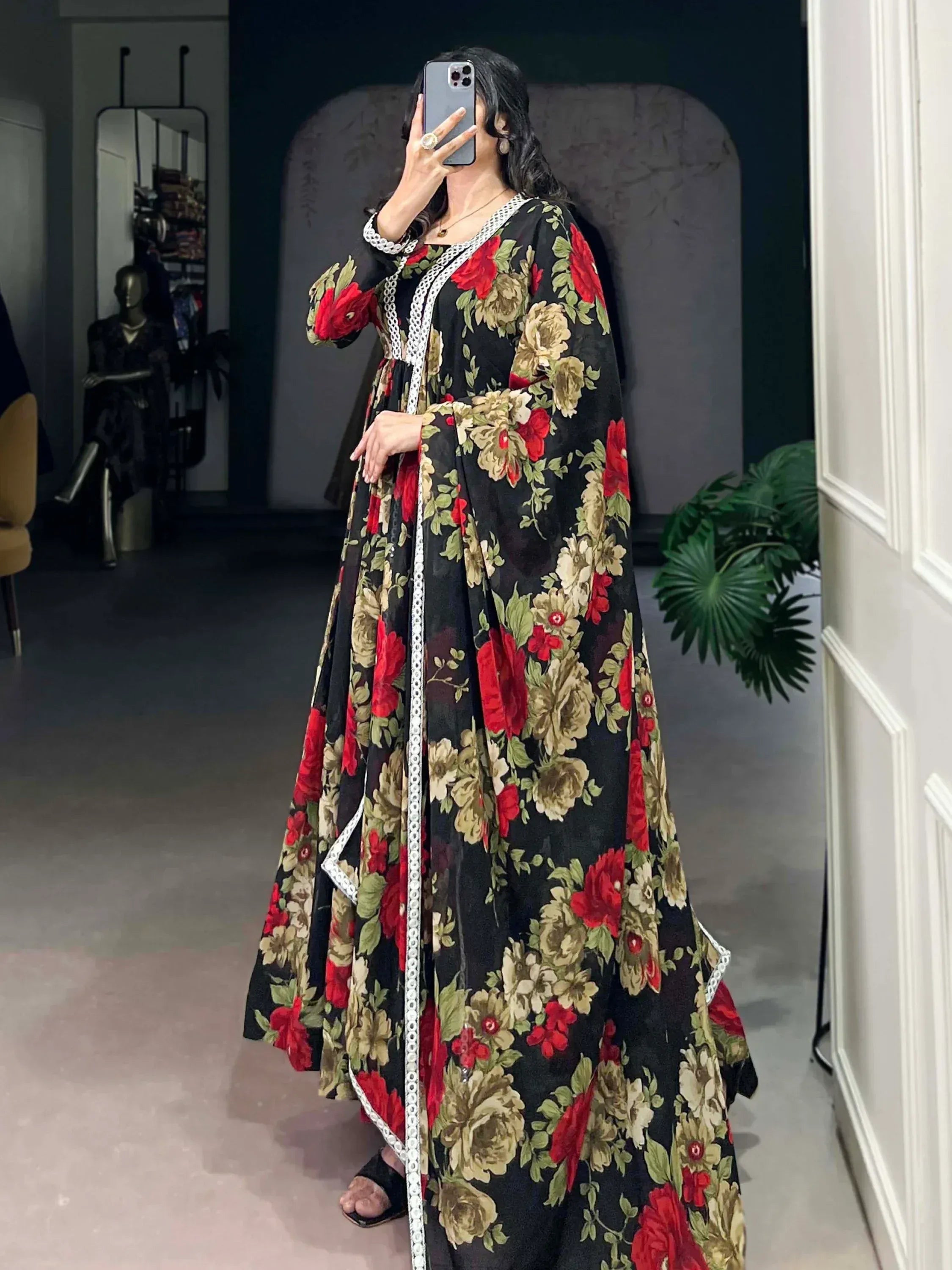 Black floral ethnic gown with red and gold roses, white lace trim, perfect for Indian occasions