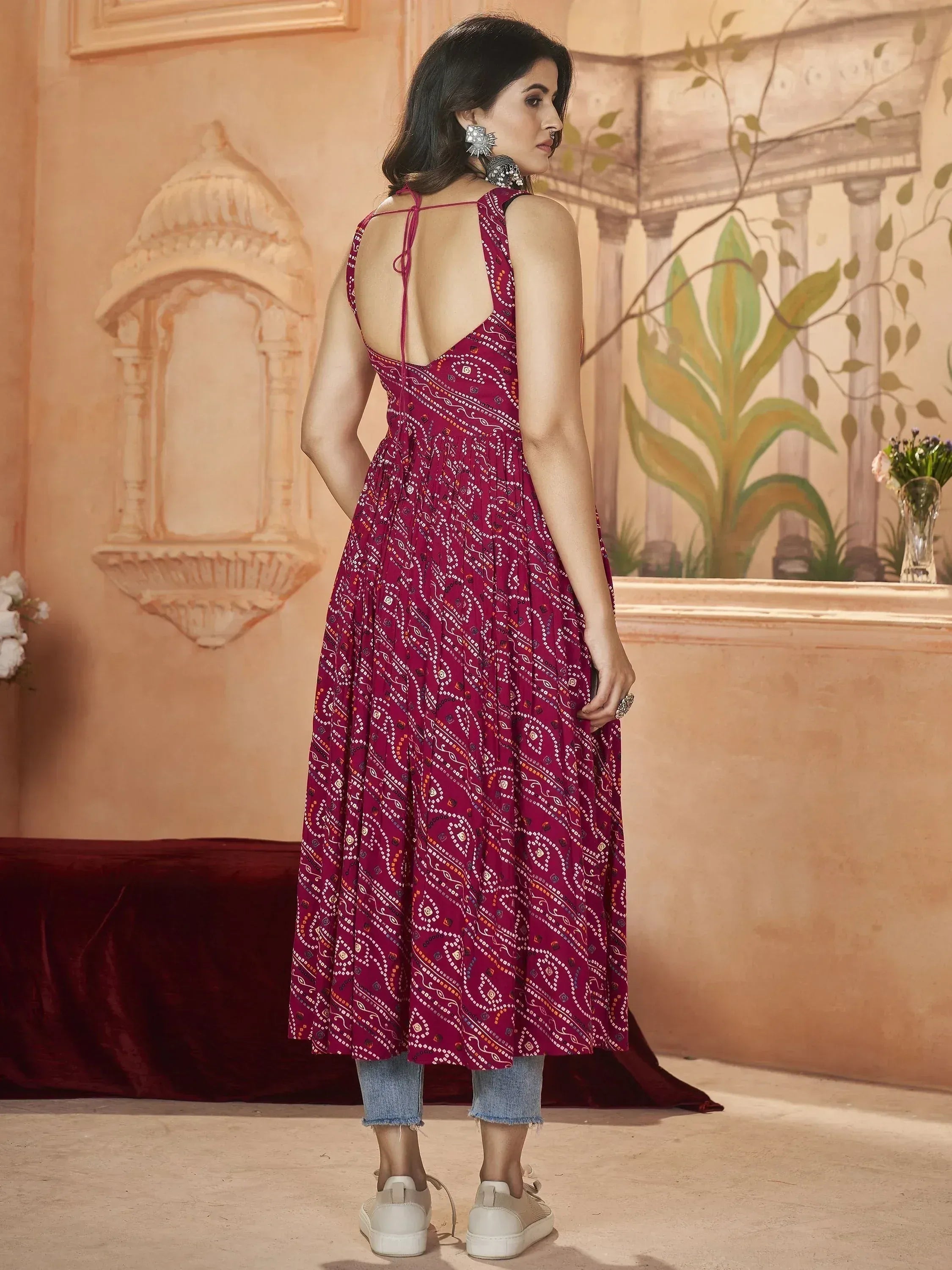 Maroon printed ethnic gown with back tie, paired with jeans and sneakers, perfect for casual Indian wear.