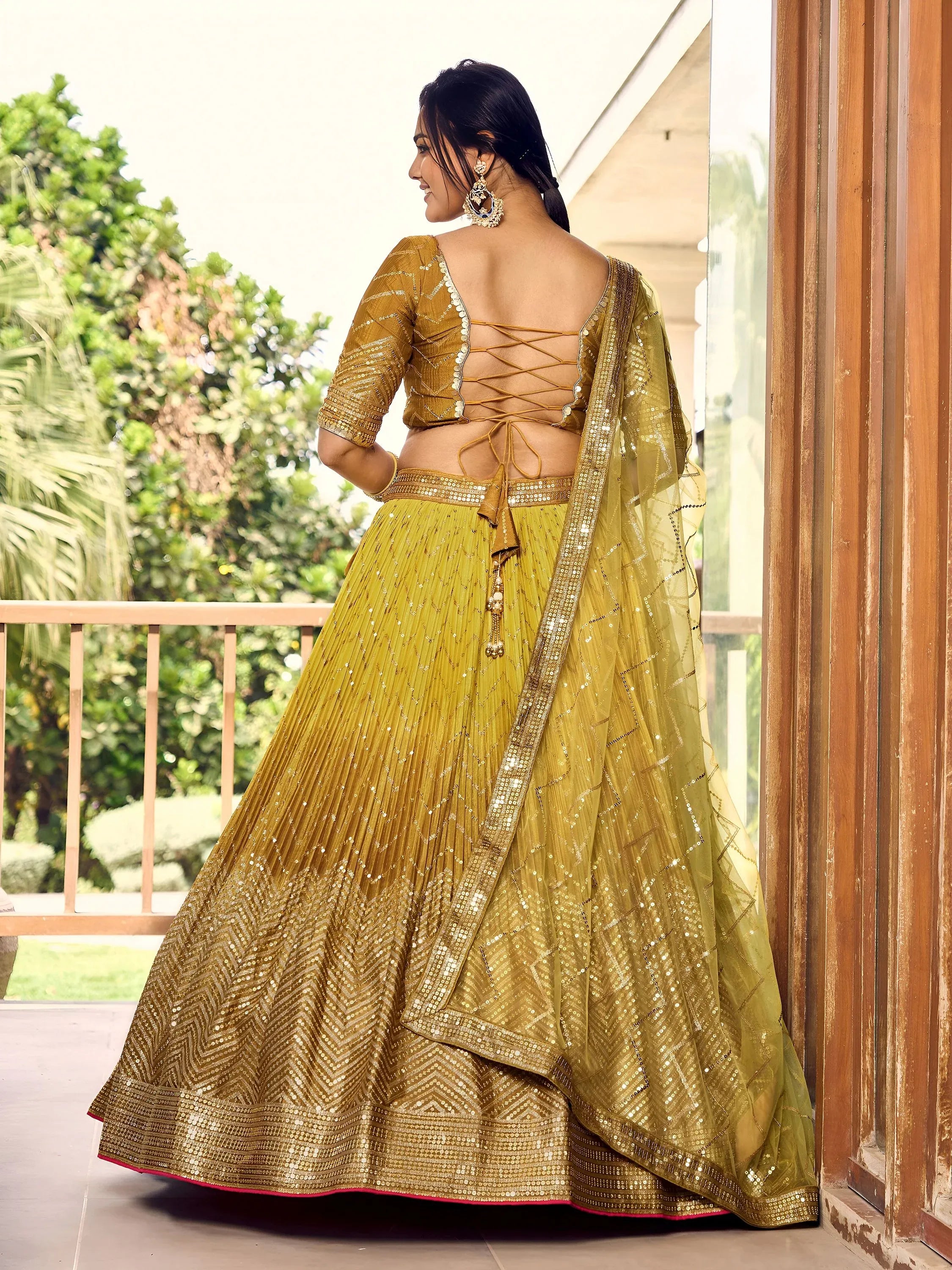 Outstanding Yellow Sequins Chinon Haldi Wear Lehenga Choli