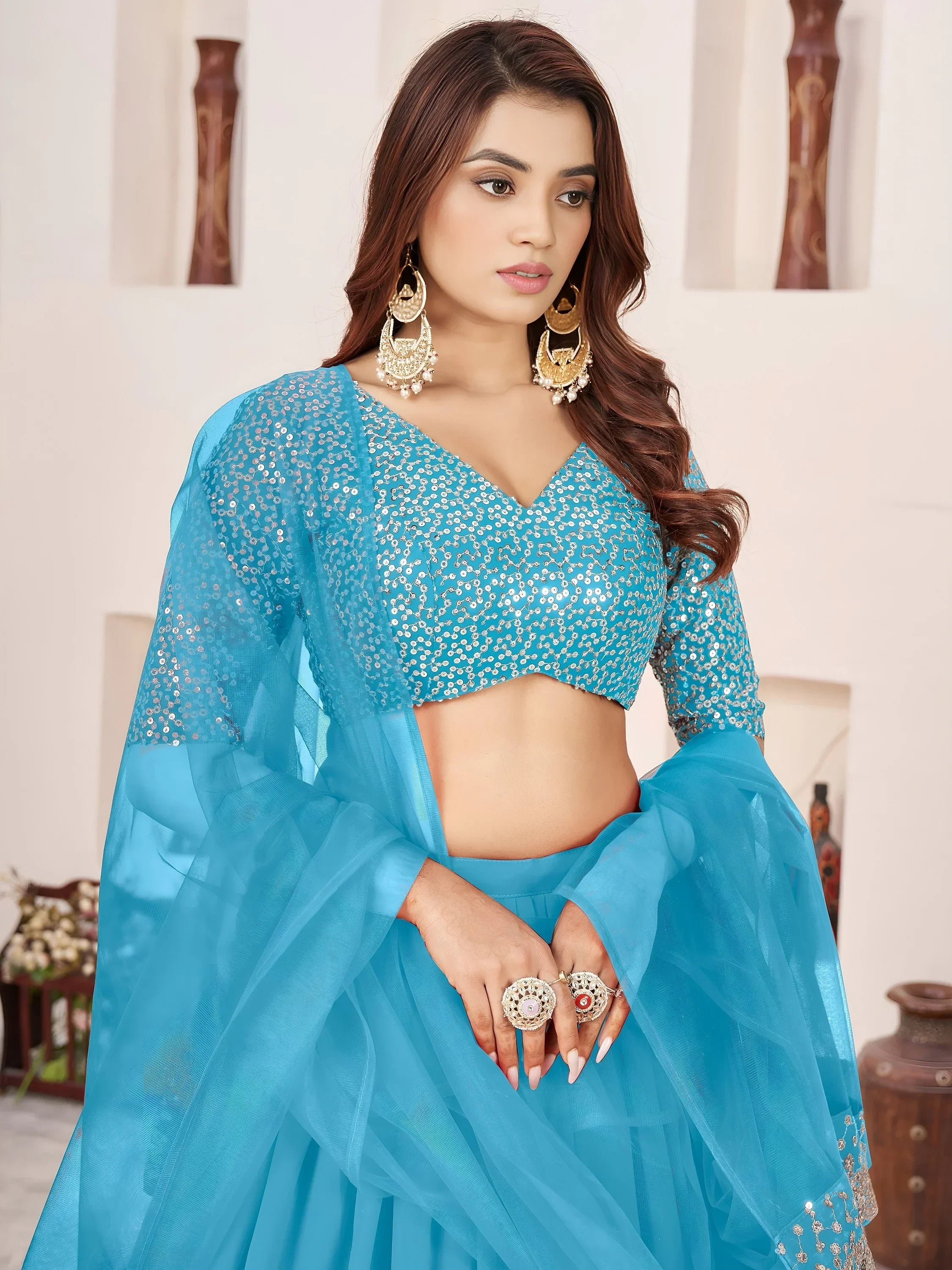 Dazzling Sky Blue Sequins Georgette Sangeet Wear Lehenga Choli