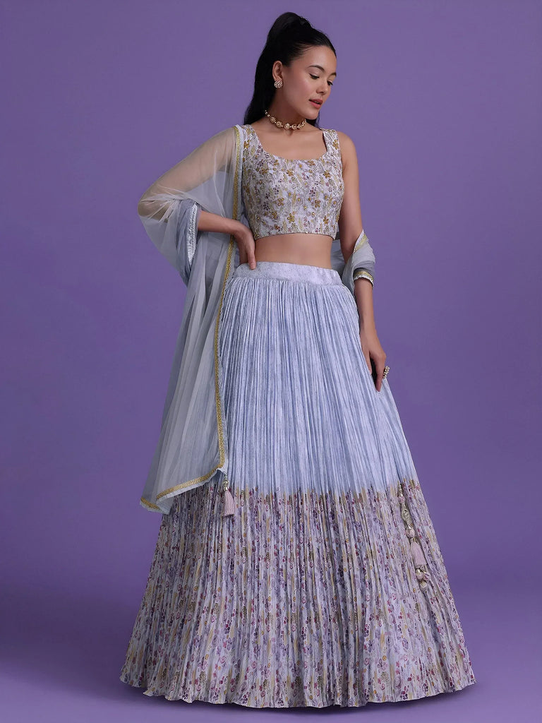 Elegant lavender lehenga choli with floral embroidery, pleated skirt, and sheer dupatta for Indian ethnic wear