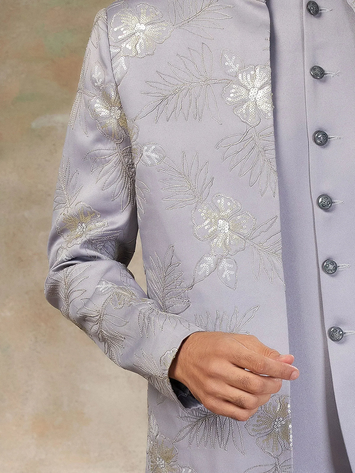 Lavender ethnic sherwani with floral sequin embroidery and silver buttons, perfect for Indian weddings or festive occasions.