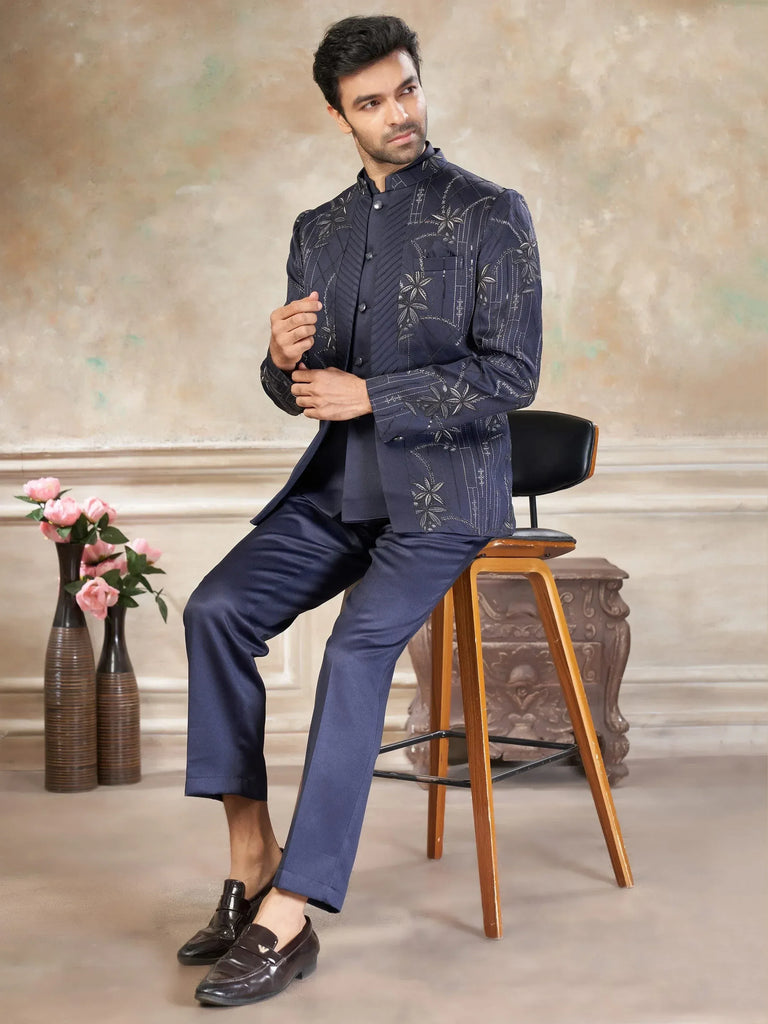 Man in navy blue embroidered Indo-Western sherwani with matching pants, ideal for weddings and festive occasions