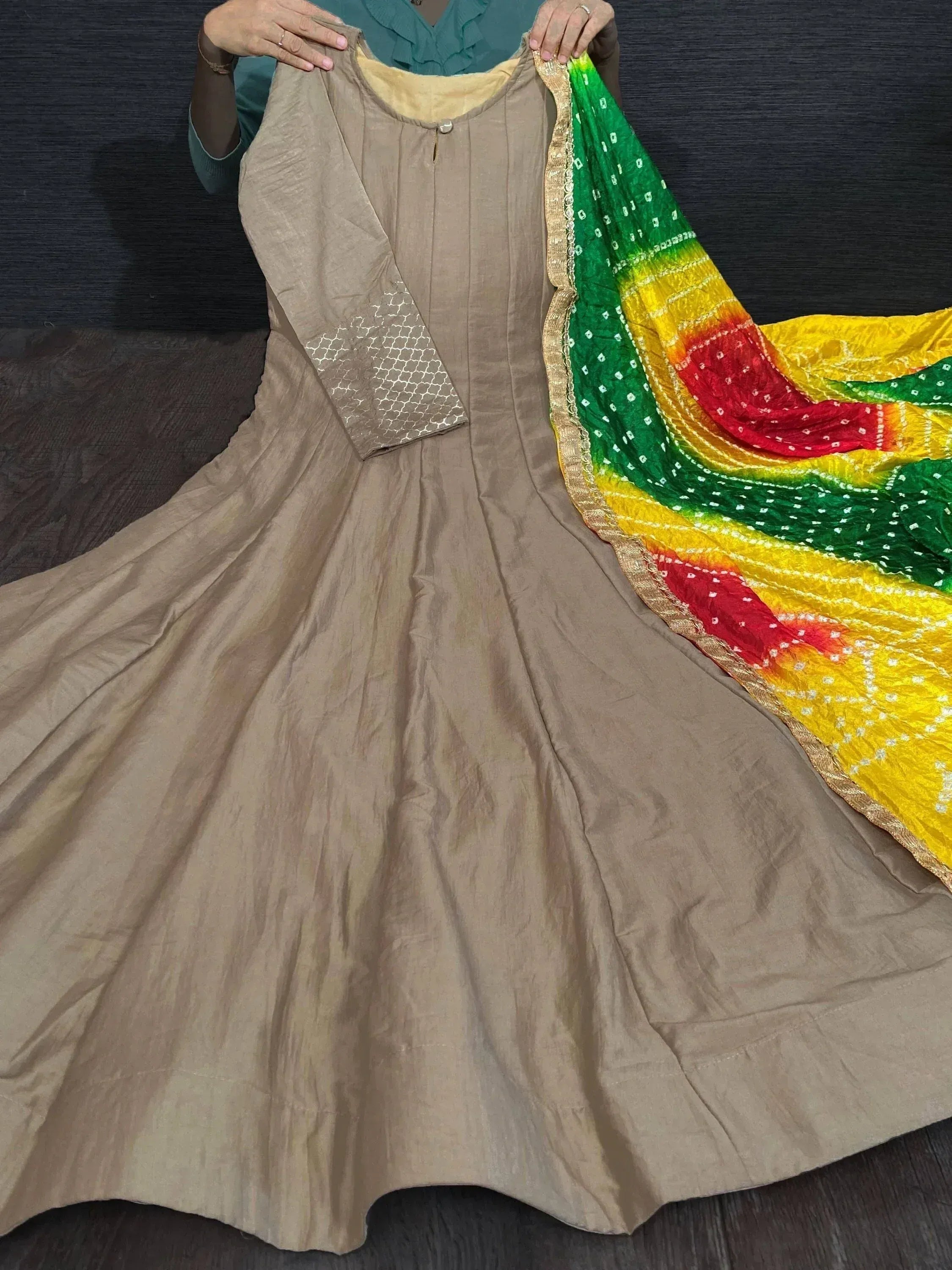 Beige ethnic anarkali with colorful bandhani dupatta, perfect for Indian festive wear