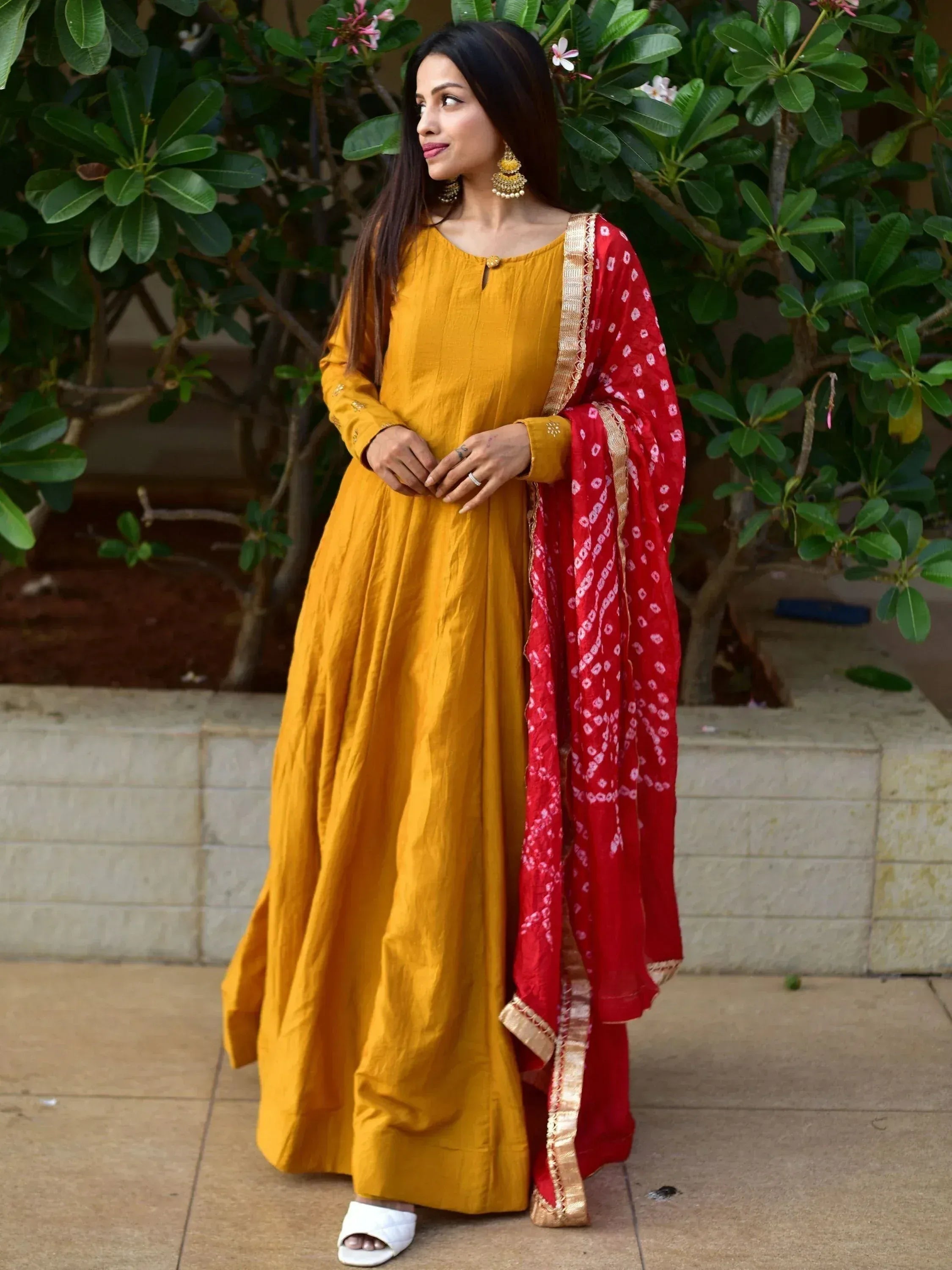 Yellow ethnic gown with red dupatta, perfect for Indian festive occasions
