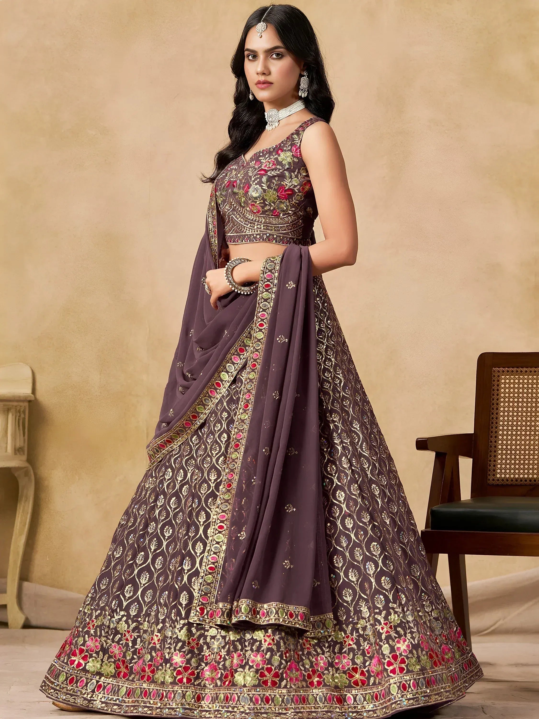 Elegant purple lehenga choli with floral embroidery and gold detailing, perfect for Indian ethnic occasions.