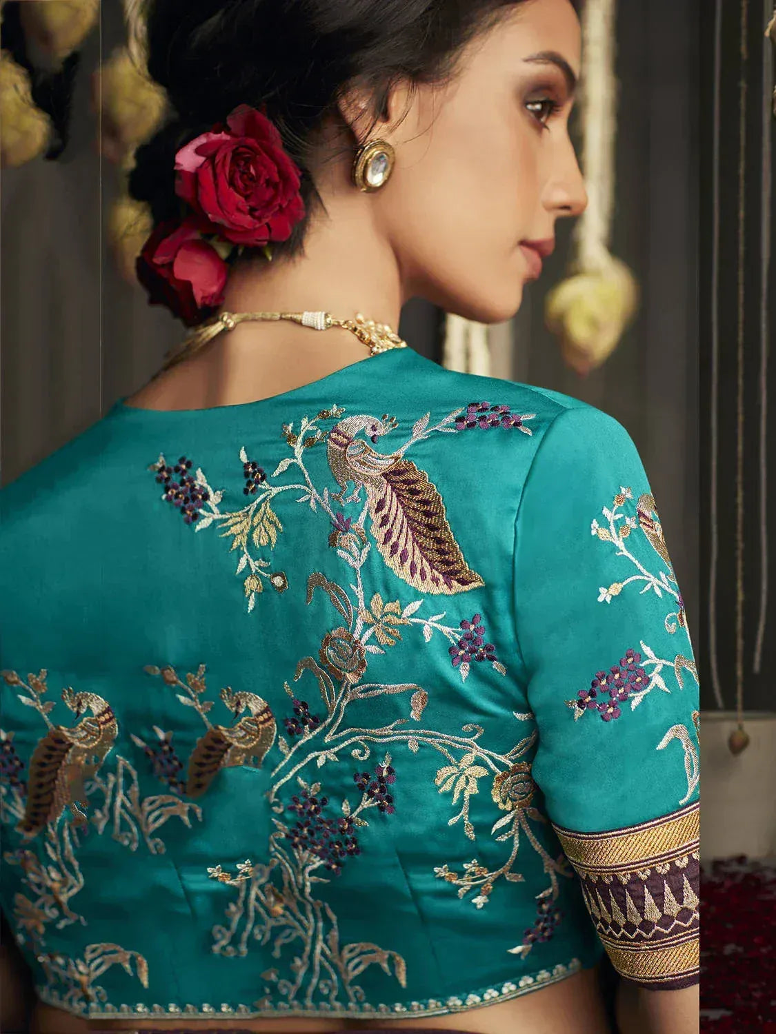 Teal embroidered blouse with peacock and floral motifs, perfect for Indian ethnic wear