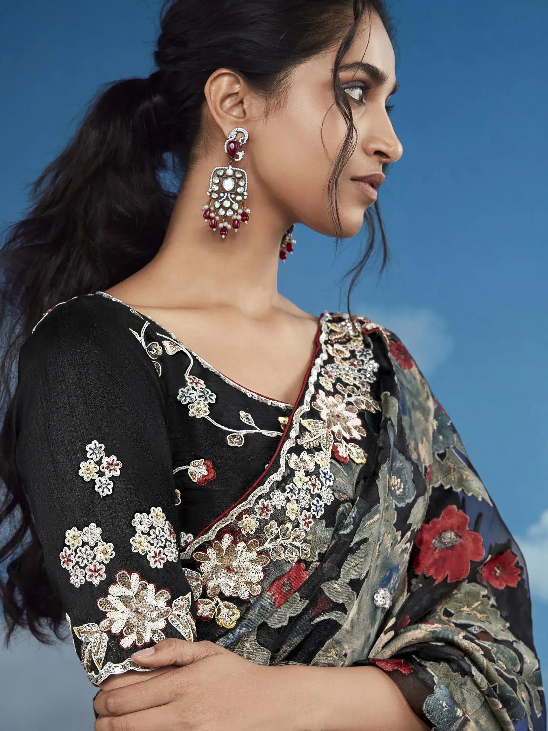 Black floral embroidered salwar kameez with matching dupatta and statement earrings