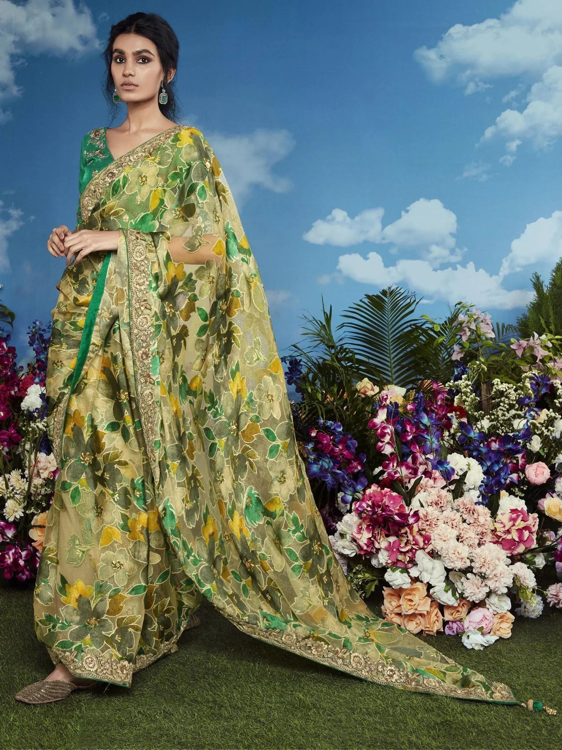 Green floral printed saree with gold embroidery, perfect for Indian ethnic wear occasions