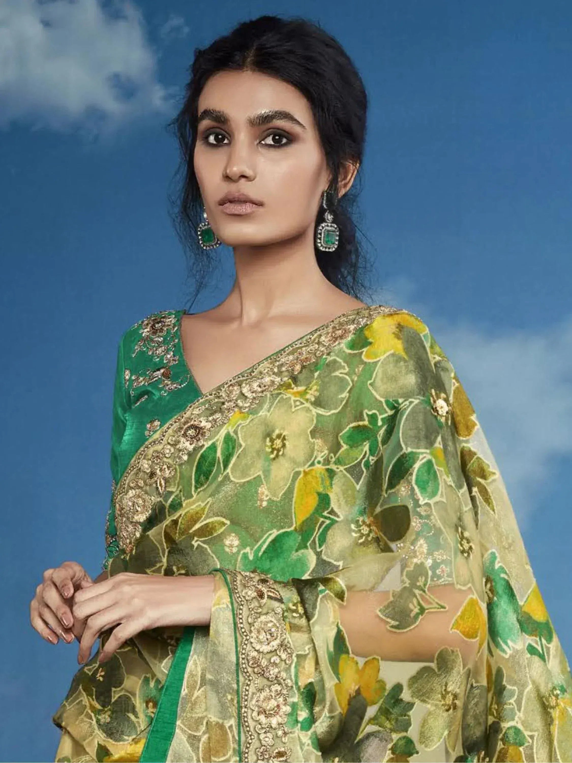 Elegant green floral saree with gold embroidery, perfect for Indian ethnic wear occasions.