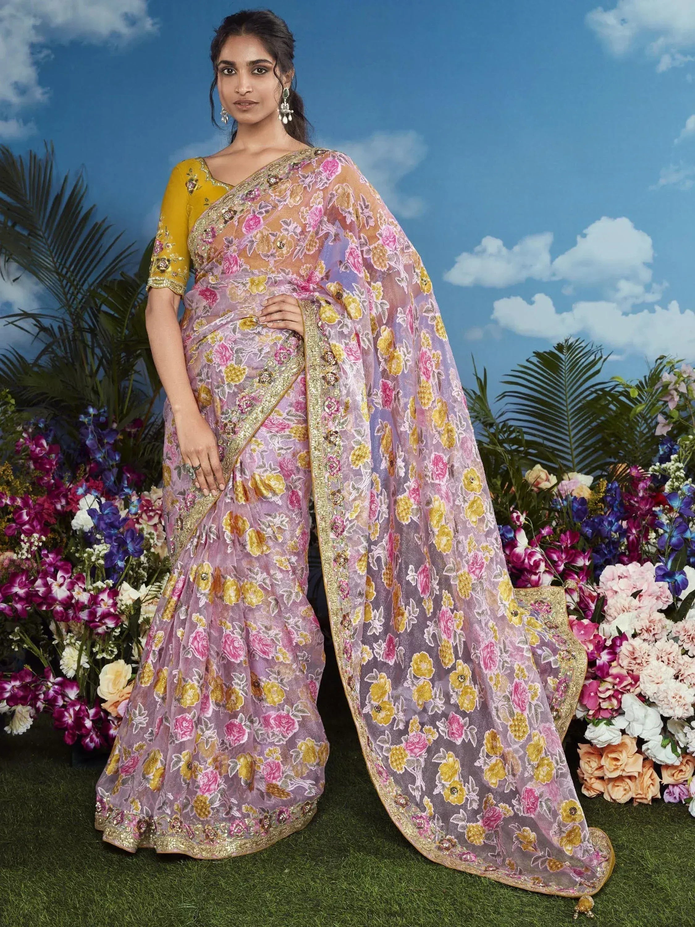 Elegant floral saree with gold border, paired with yellow blouse, perfect for Indian ethnic occasions