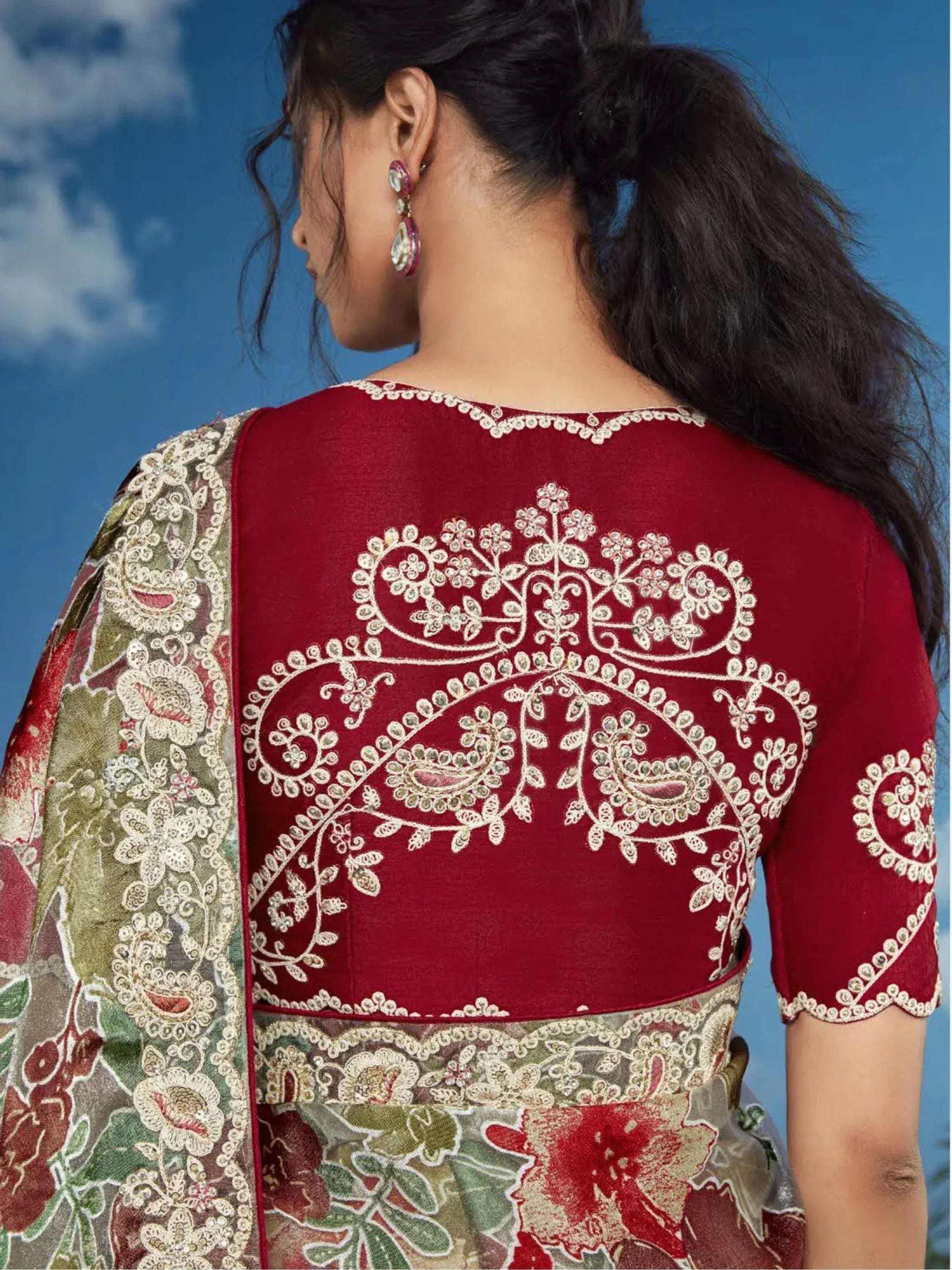 Maroon embroidered blouse with floral paisley back design, paired with printed saree, ethnic wear