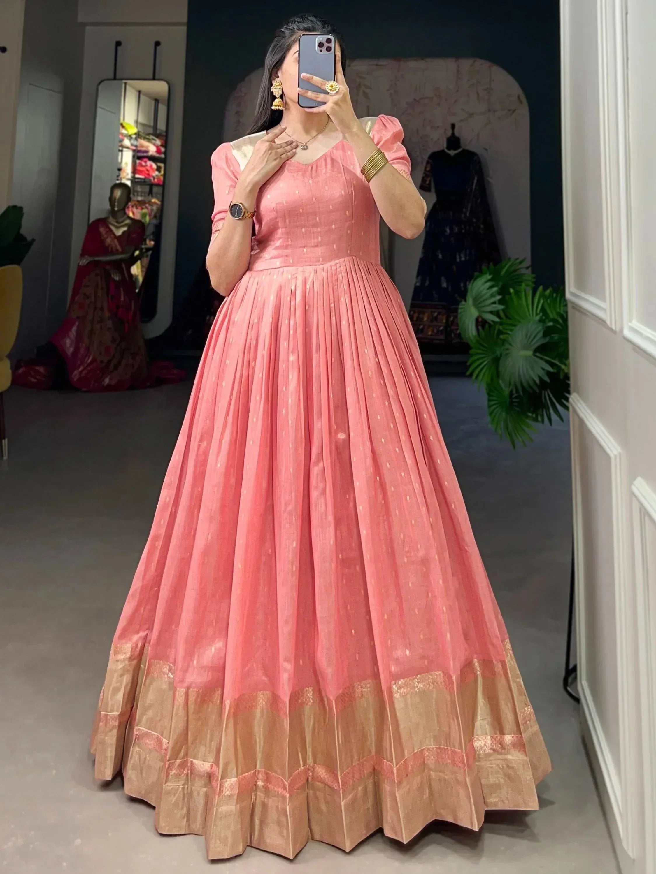 Pink ethnic gown with gold border, pleated skirt, puff sleeves for Indian occasions