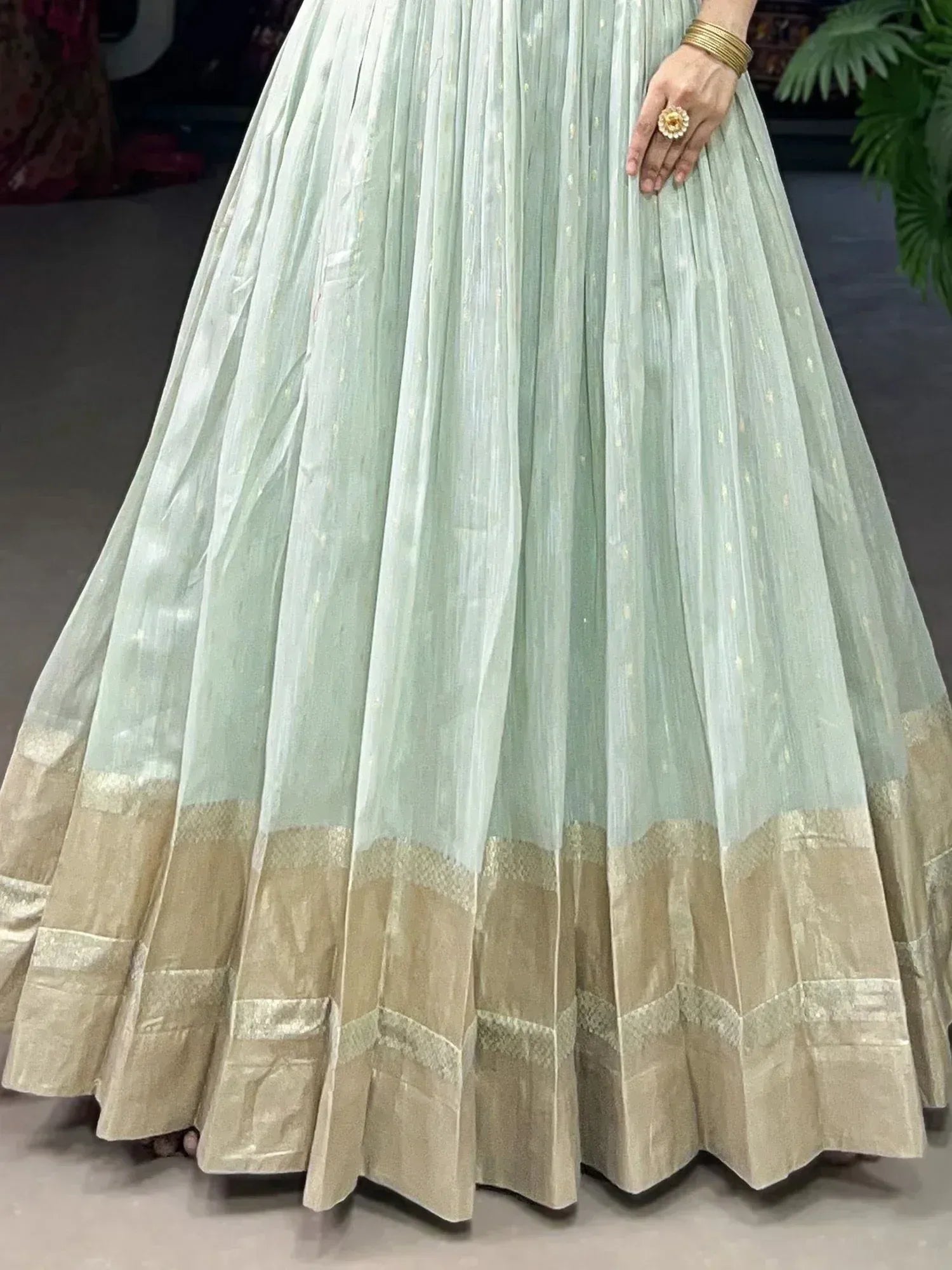 Mint green pleated lehenga with gold border, ethnic wear for women