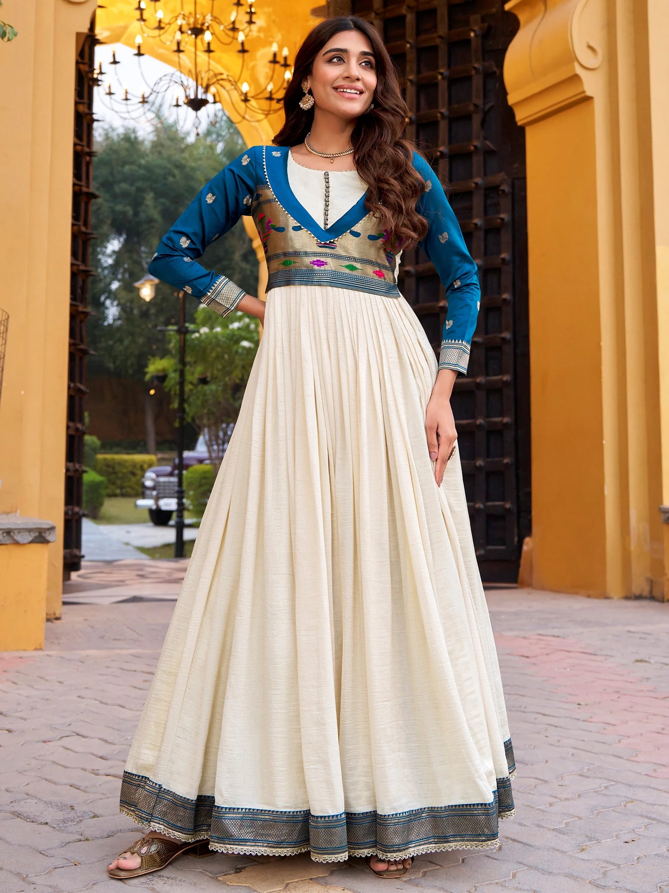 Mesmerizing Off White Zari Weaving Silk Festival Wear Gown
