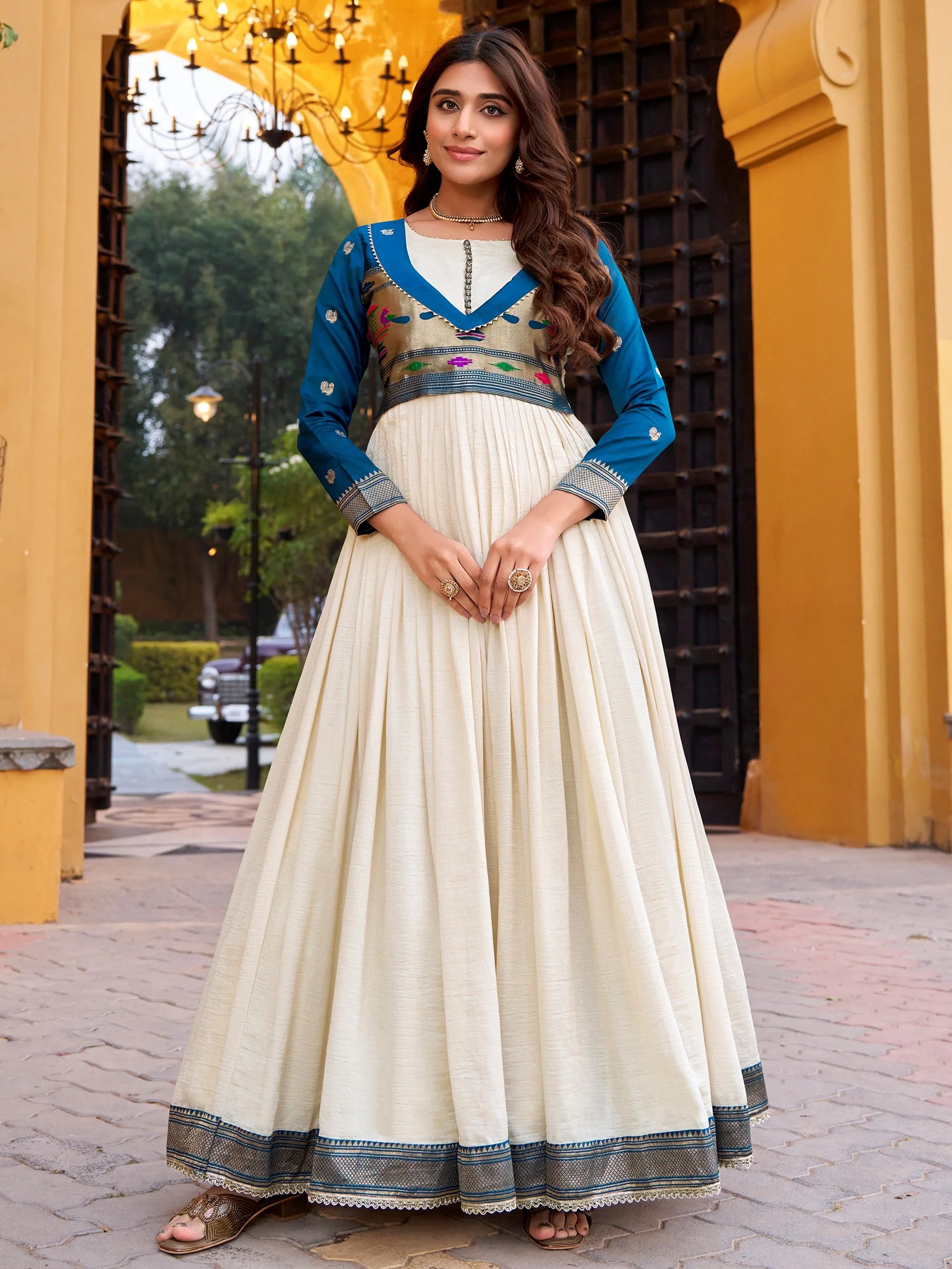 Mesmerizing Off White Zari Weaving Silk Festival Wear Gown