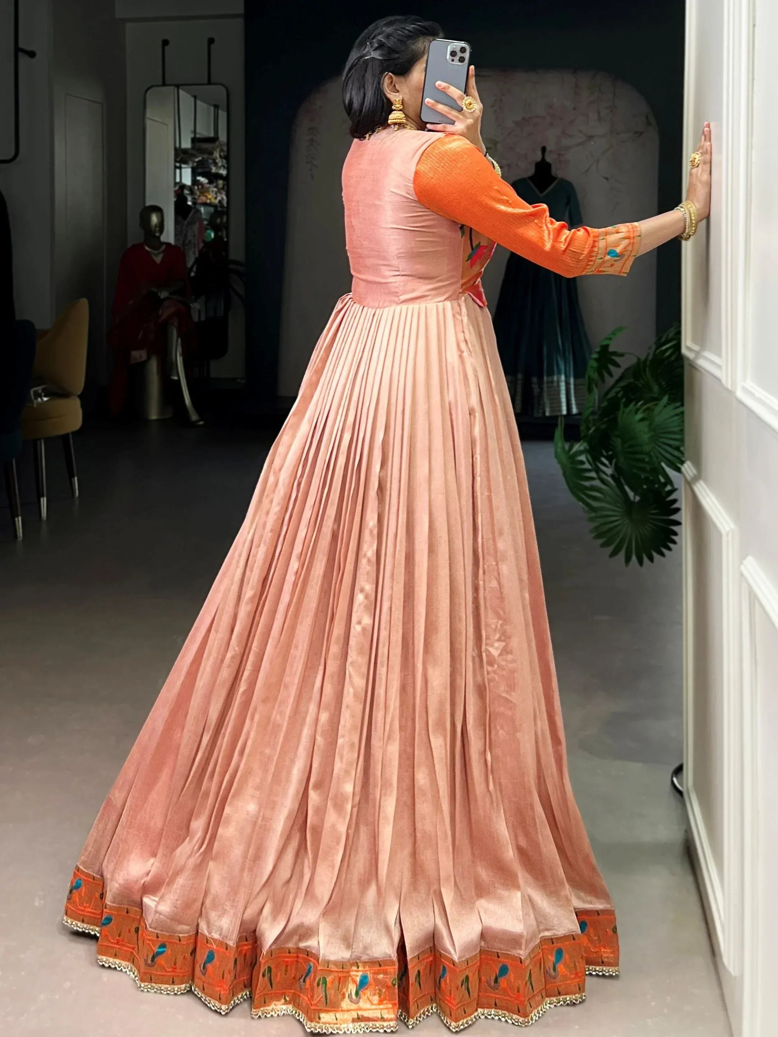 Captivating Peach Zari Weaving Silk Function Wear Gown
