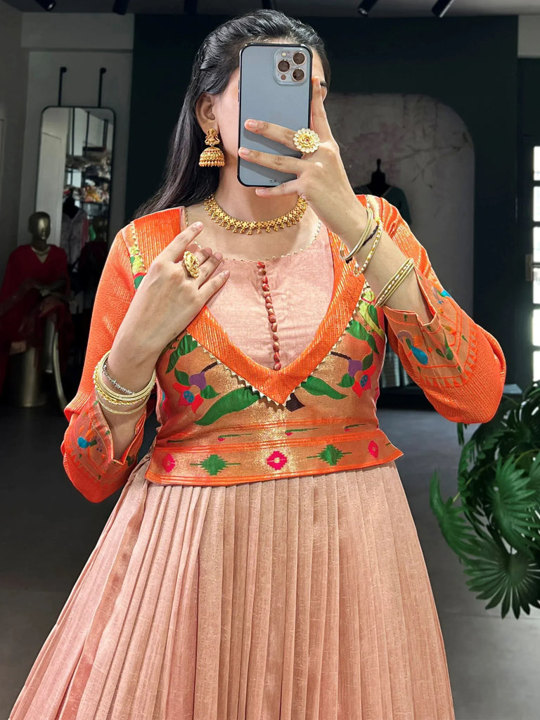 Captivating Peach Zari Weaving Silk Function Wear Gown