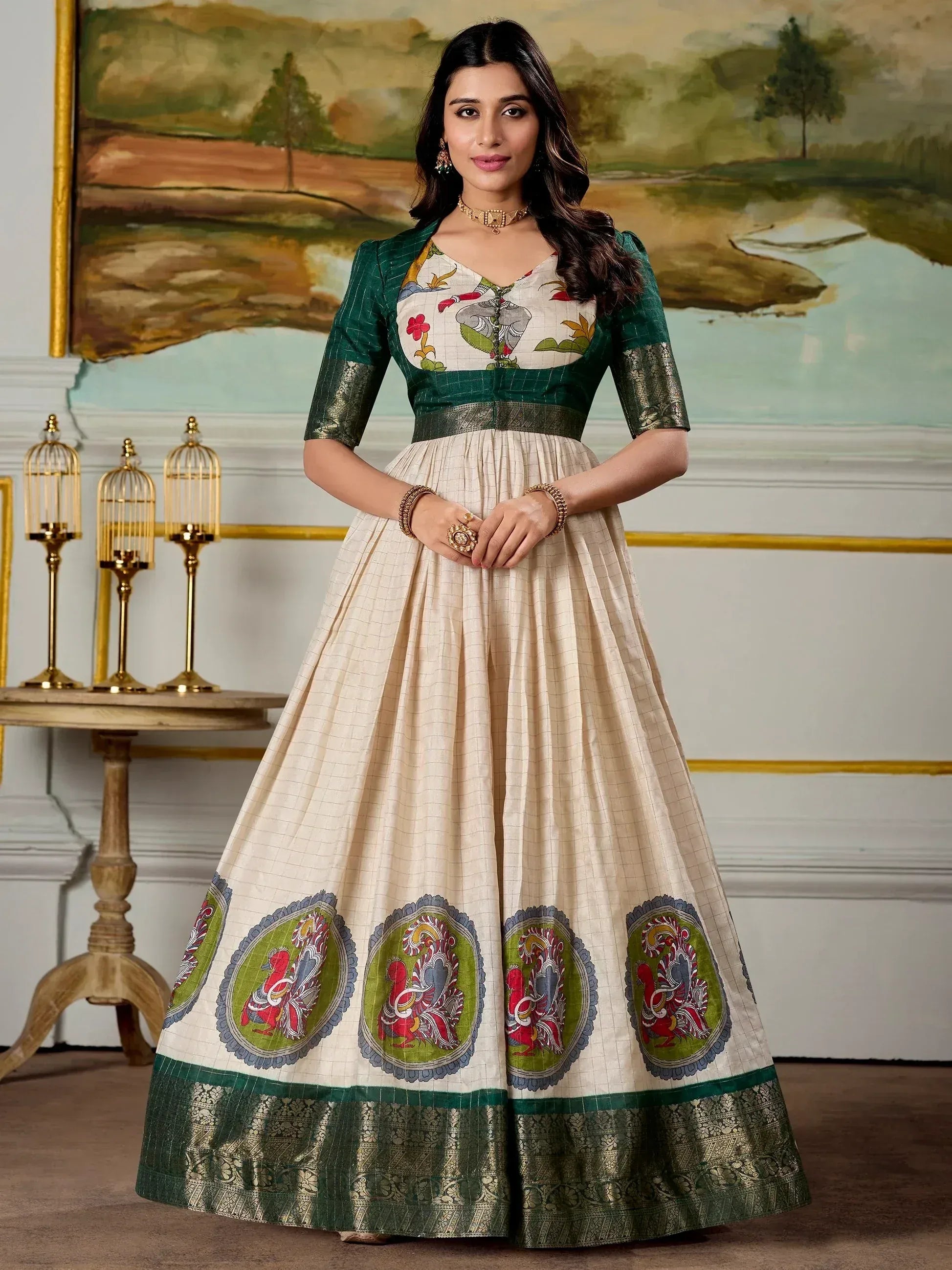 Elegant cream and green ethnic gown with elephant and peacock print, perfect for Indian occasions
