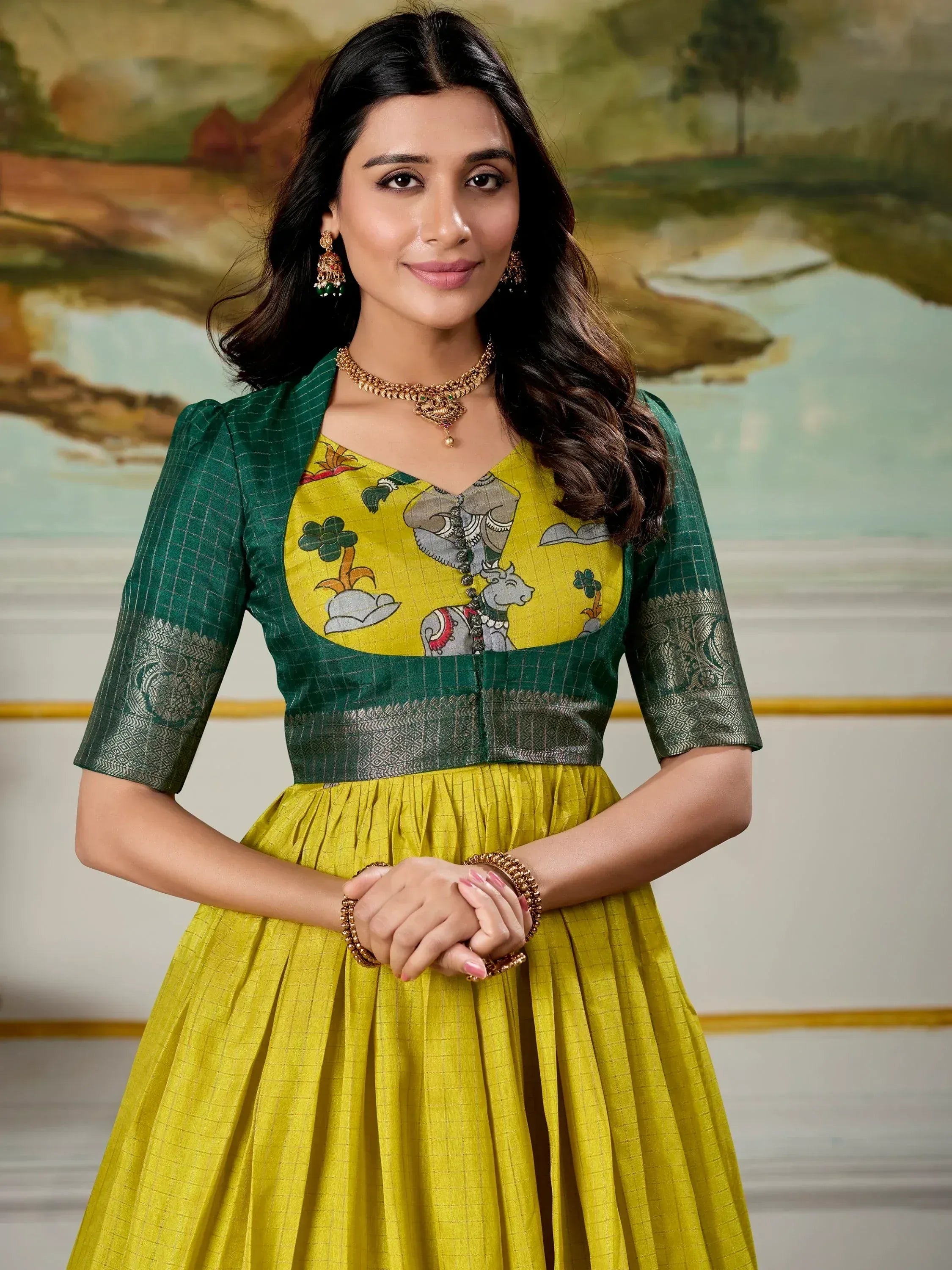 Yellow and green ethnic gown with elephant print, perfect for Indian occasions and festive wear.