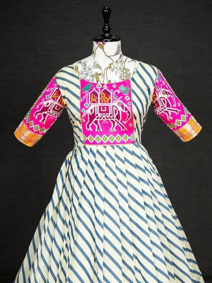 Blue and white striped ethnic gown with pink elephant embroidery, perfect for Indian festive occasions.