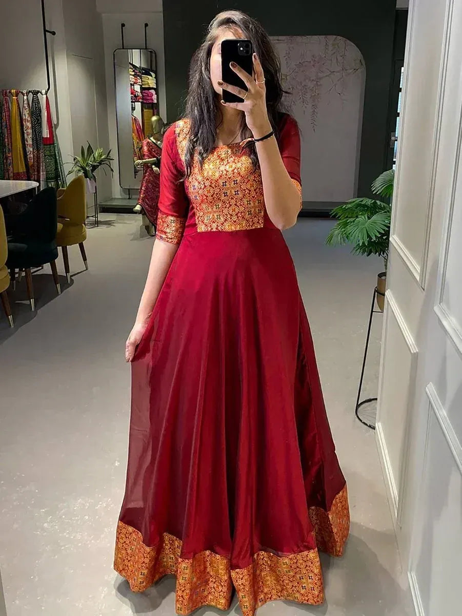 Red ethnic gown with orange floral print, perfect for Indian occasions and festive wear