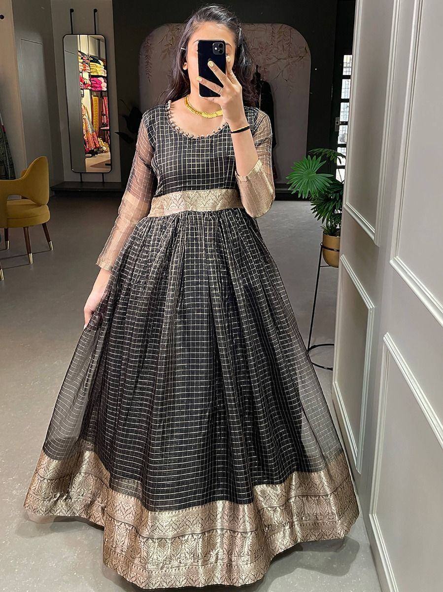 Black and gold checkered ethnic gown with sheer sleeves and embroidered border, perfect for festive occasions.