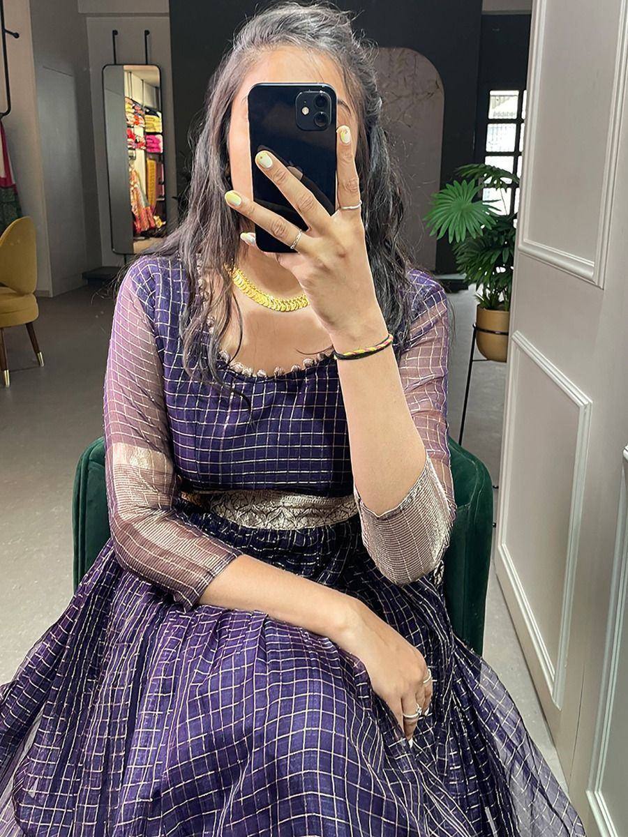 Purple checkered ethnic gown with sheer sleeves and gold necklace