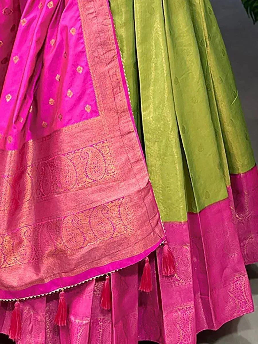 Pink and green silk lehenga with gold zari embroidery and tassel detailing