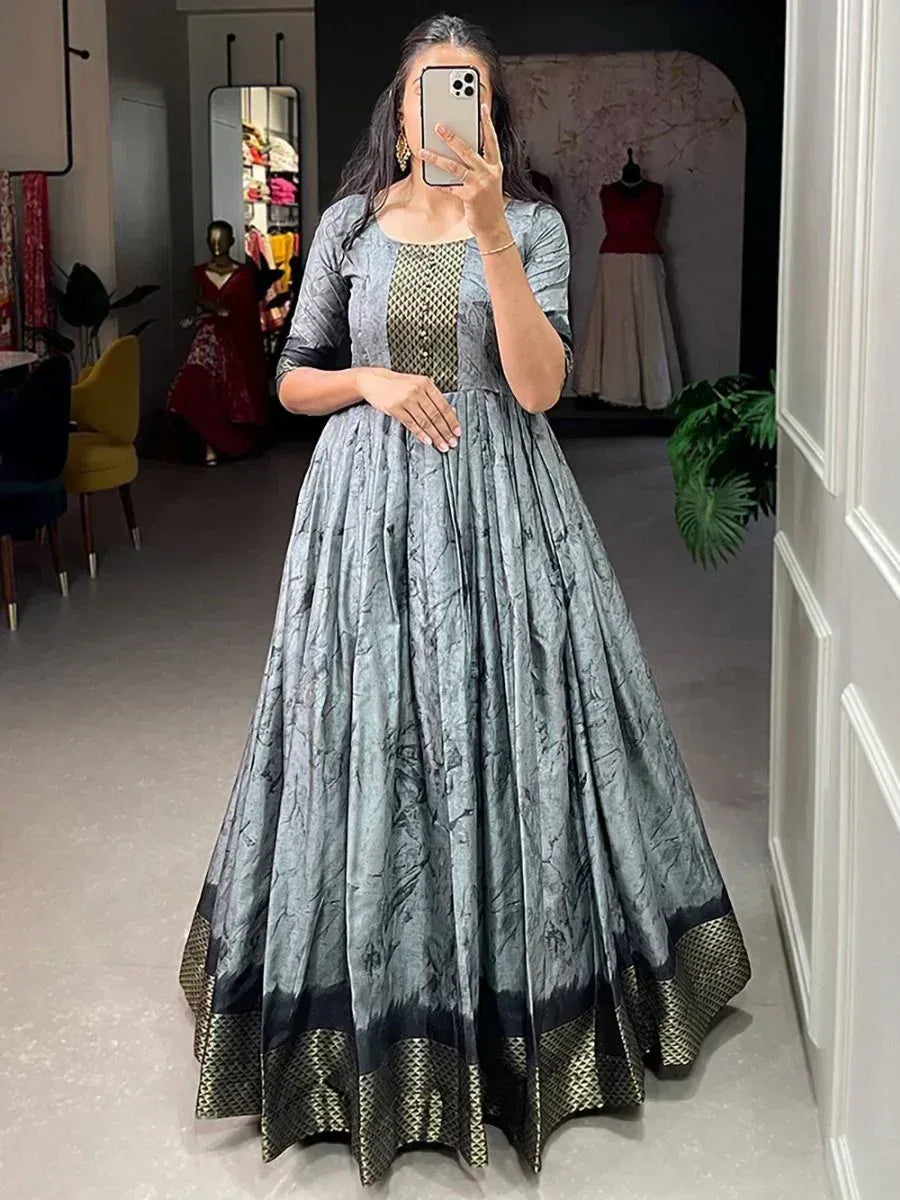 Grey printed ethnic gown with gold geometric border, perfect for Indian occasions and parties.