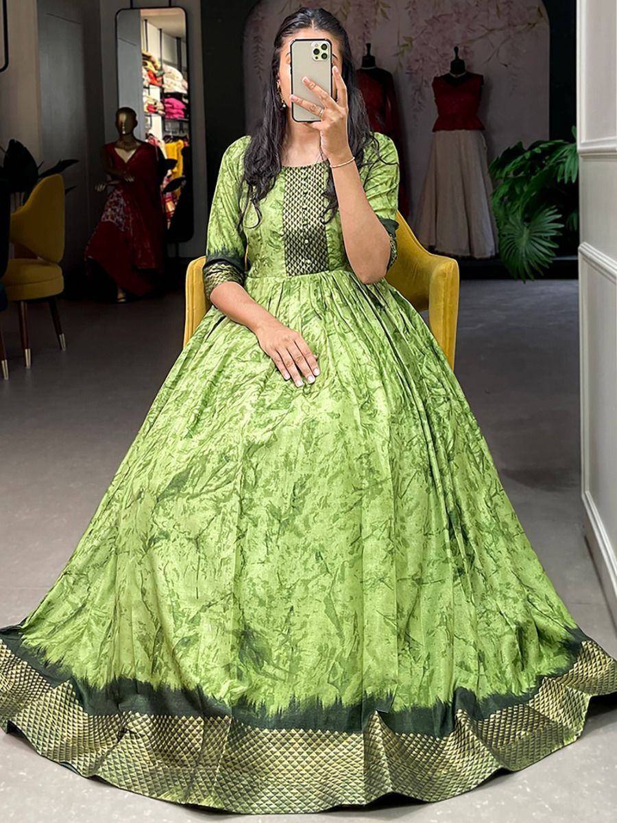 Green ethnic gown with textured print and geometric border, perfect for Indian occasions