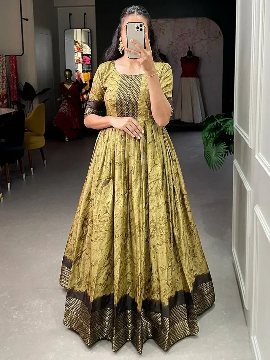 Elegant gold and brown ethnic gown with intricate patterns, perfect for Indian occasions