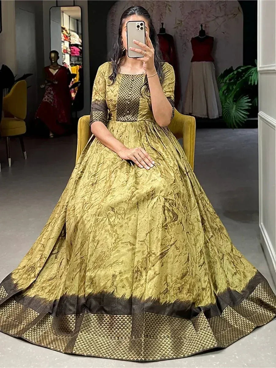 Elegant gold and brown ethnic gown with intricate patterns, perfect for festive occasions