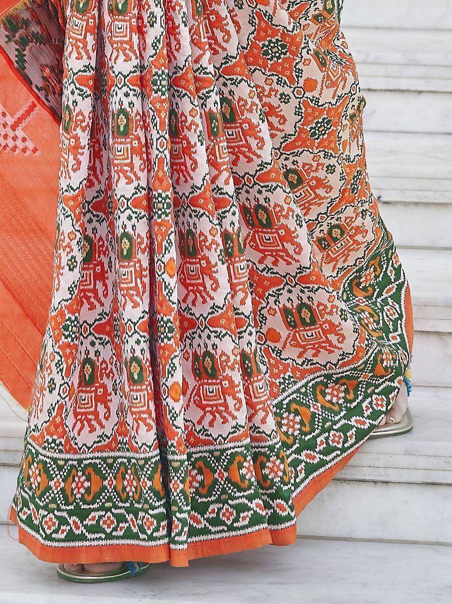 Orange green printed ethnic lehenga choli with elephant motifs, perfect for Indian weddings and festivals