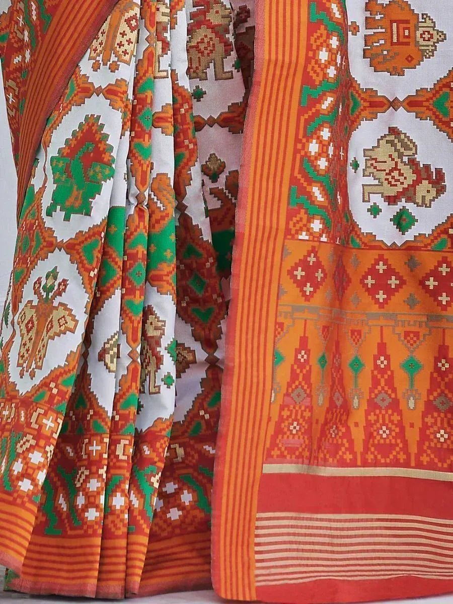 Vibrant orange and green printed saree with geometric and elephant motifs, ideal for ethnic wear occasions