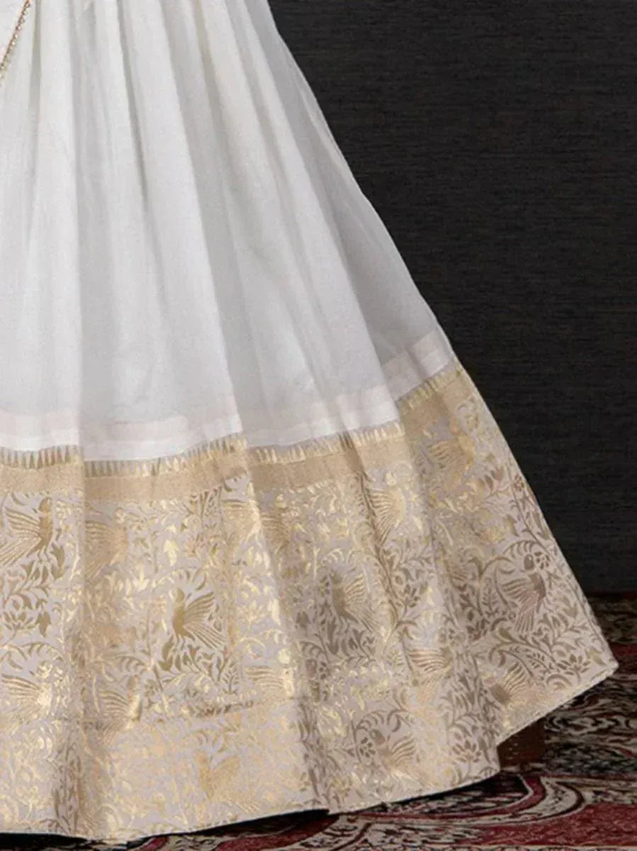 White ethnic lehenga with gold floral border, designer Indian wear