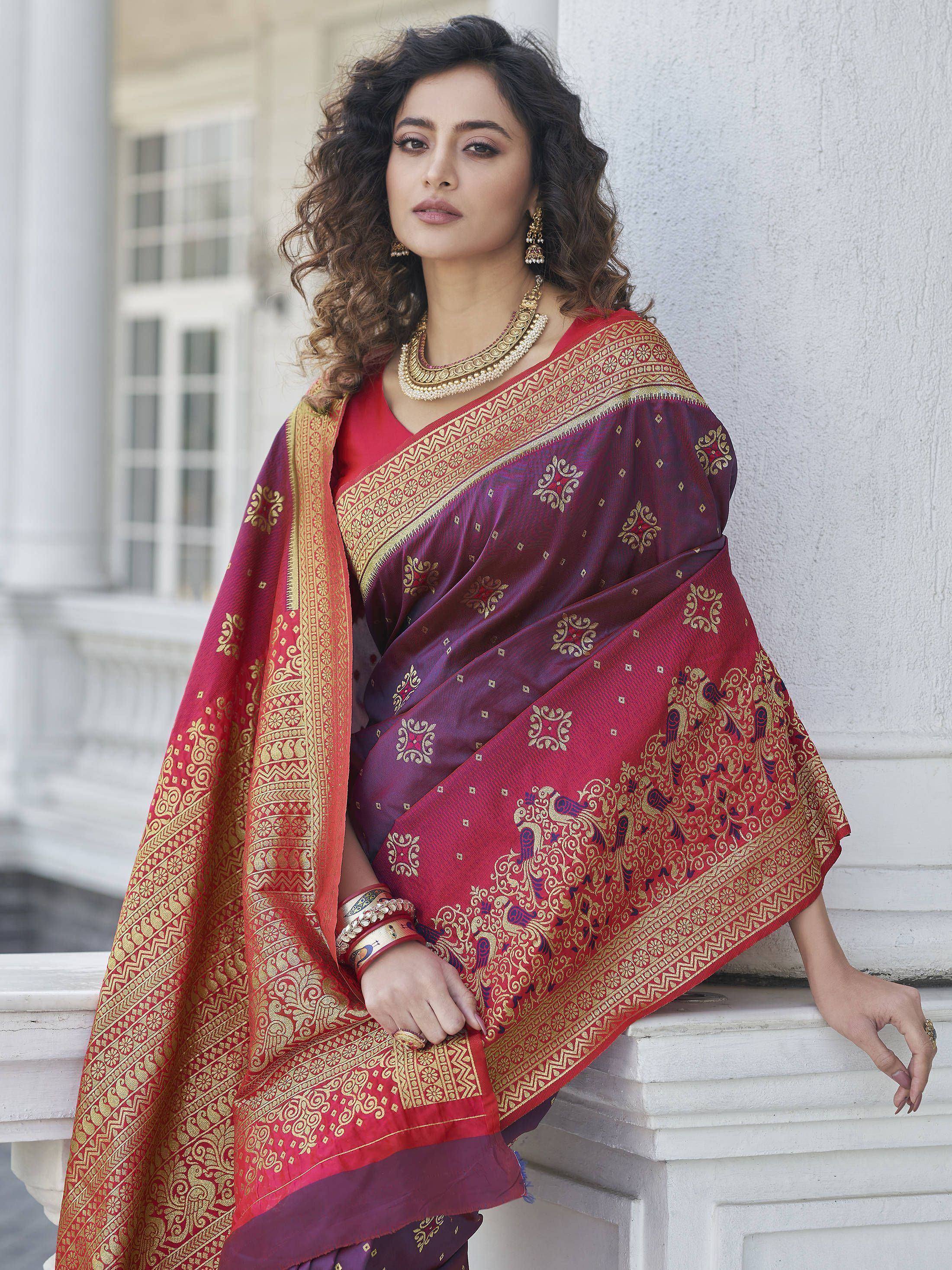 Elegant maroon and red saree with gold zari work, perfect for Indian ethnic wear occasions