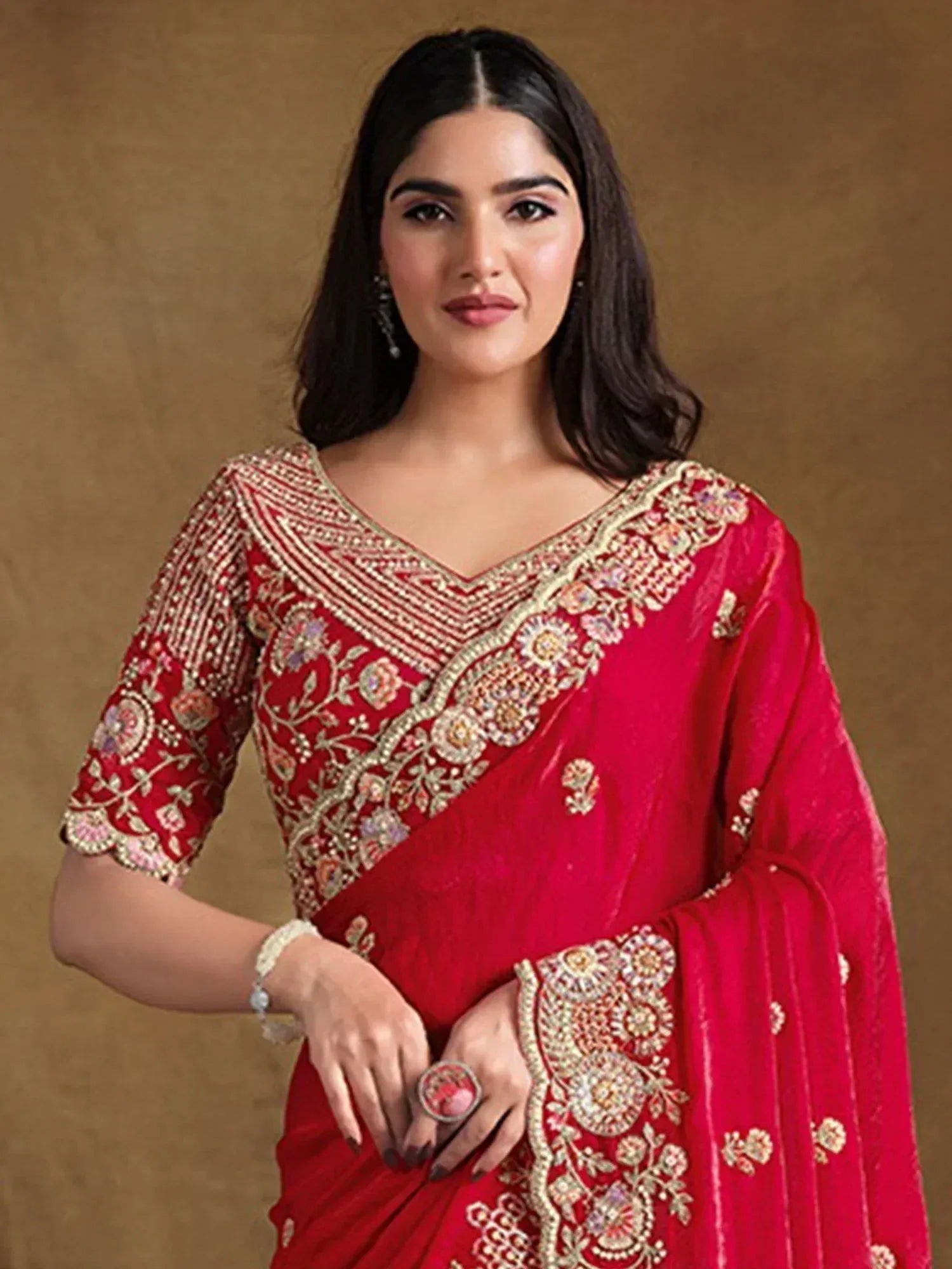 Red embroidered saree with gold floral detailing, perfect for Indian ethnic wear occasions