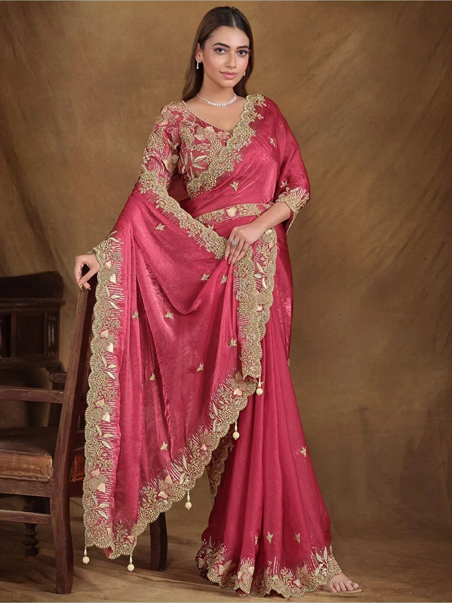 Elegant pink saree with gold embroidery, perfect for Indian ethnic wear occasions