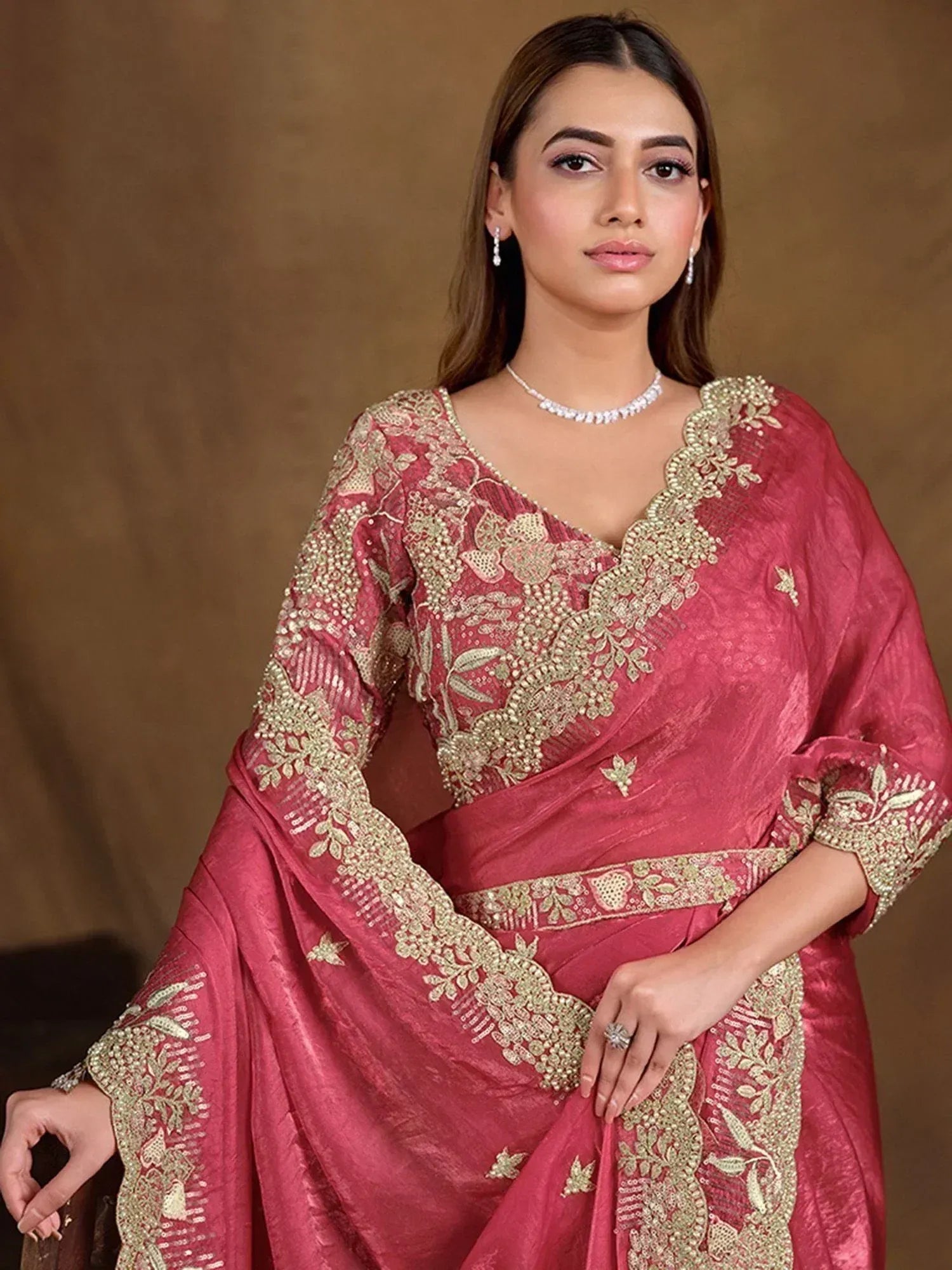 Elegant pink saree with gold embroidery, perfect for Indian ethnic wear and festive occasions.