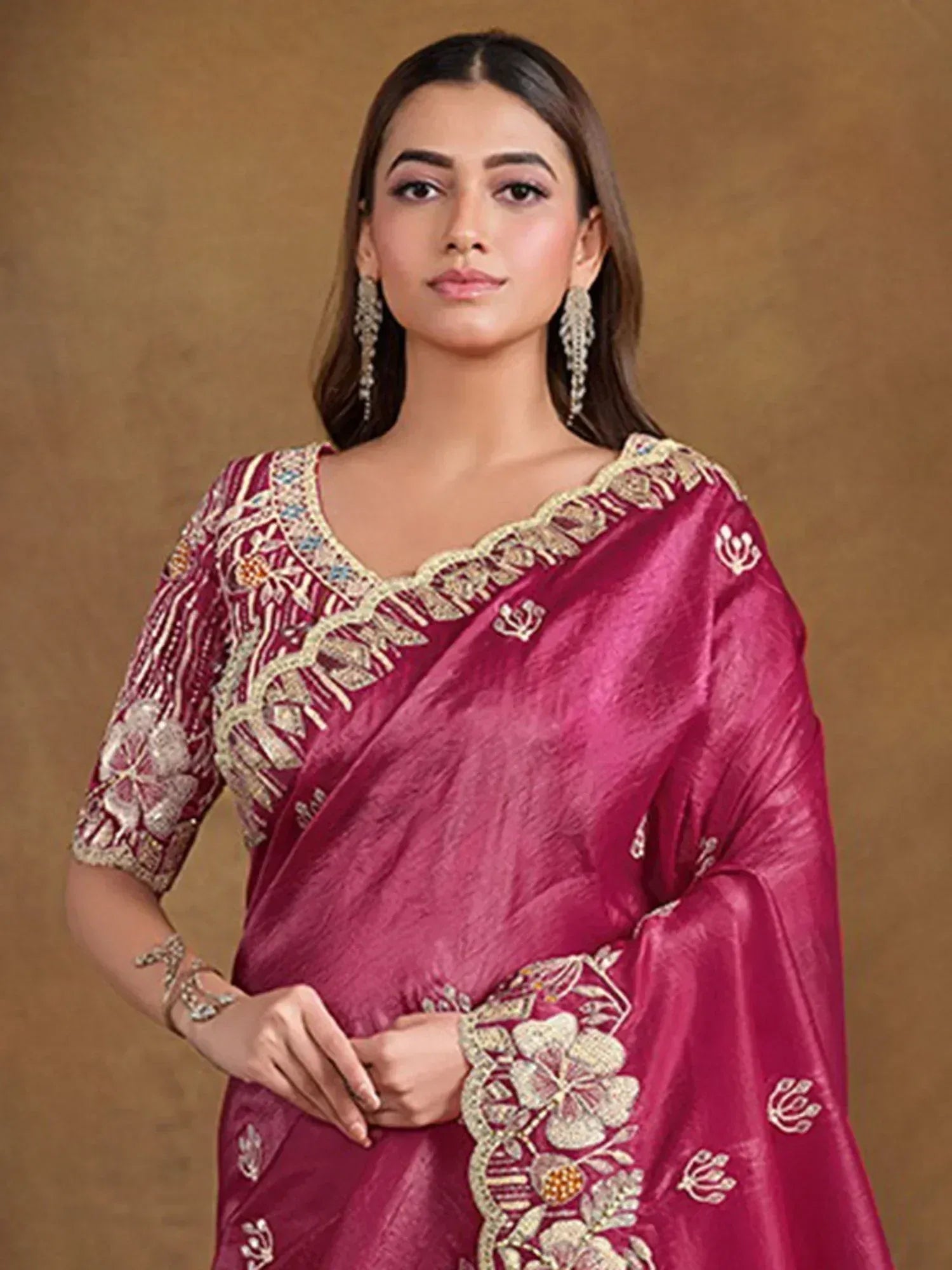 Elegant maroon saree with gold floral embroidery and embellished blouse, perfect for Indian ethnic occasions.