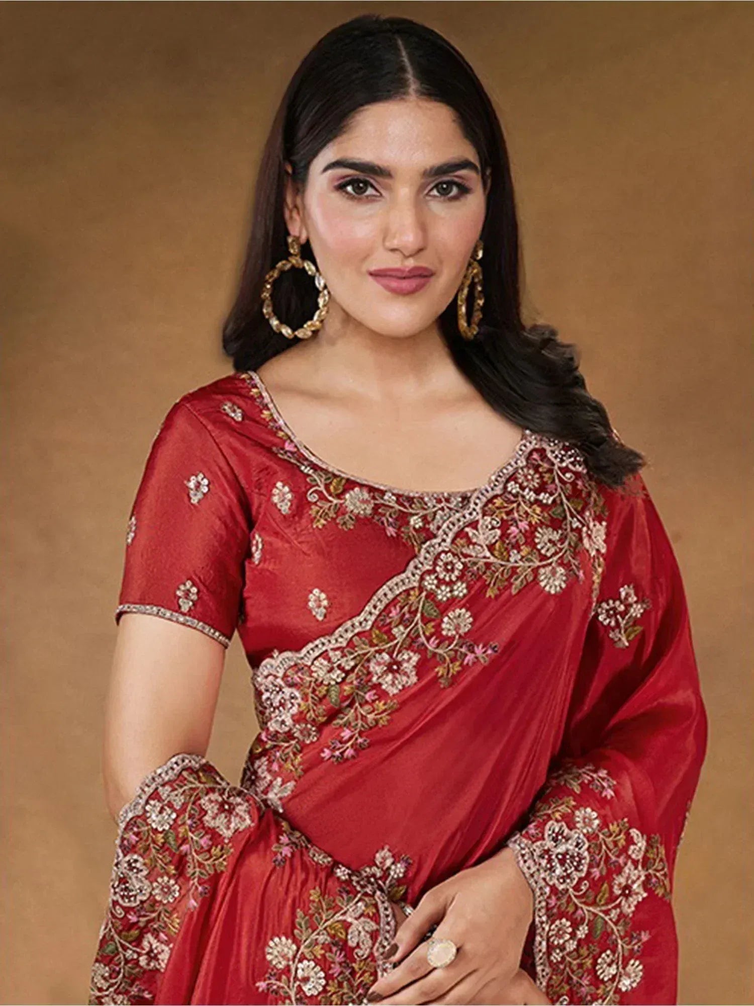 Red embroidered Indian saree with floral design, perfect for ethnic occasions and festive wear.