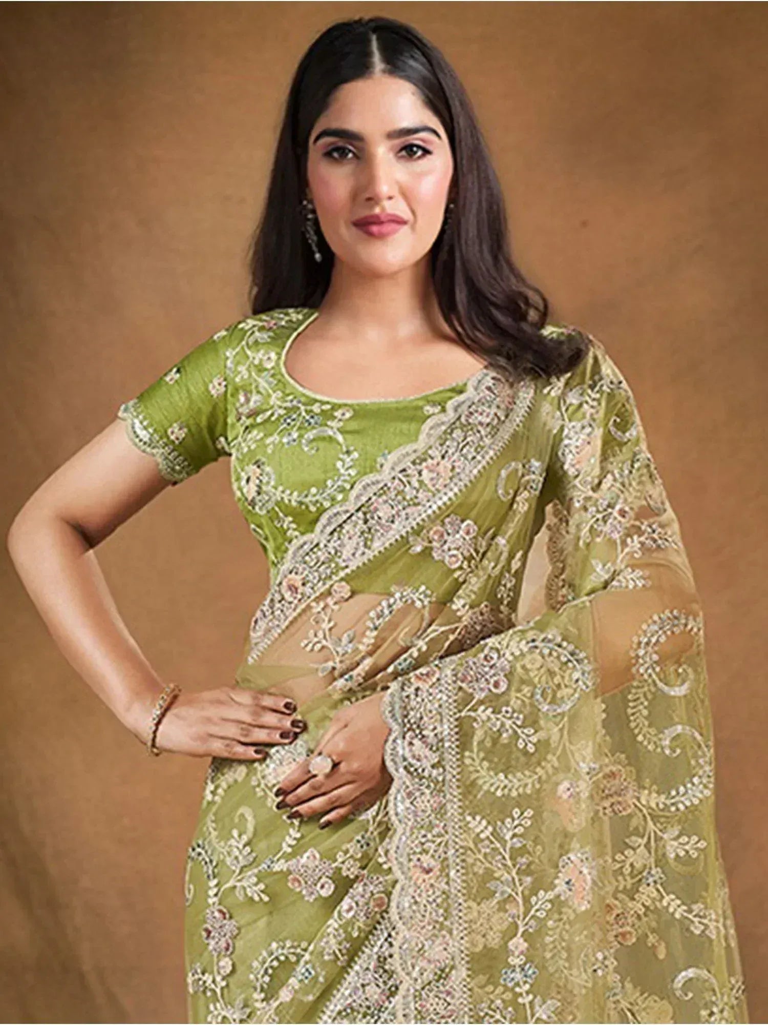 Green embroidered saree with floral design, perfect for Indian ethnic wear occasions.