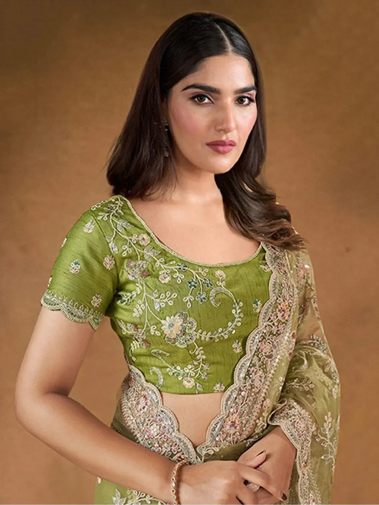 Green embroidered designer lehenga choli with floral detailing and sheer dupatta for Indian ethnic wear