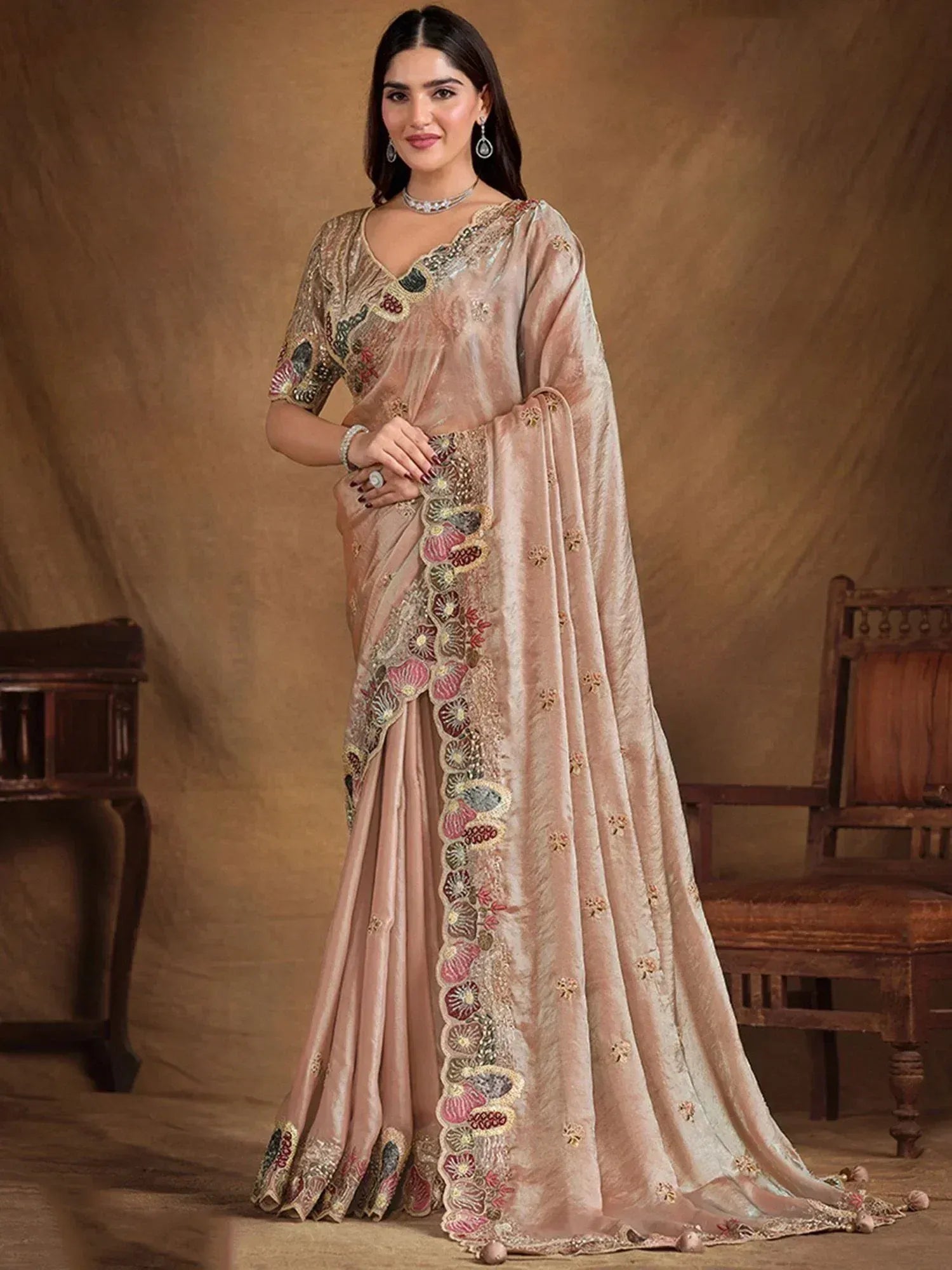 Elegant beige embroidered saree with floral motifs, perfect for Indian ethnic occasions