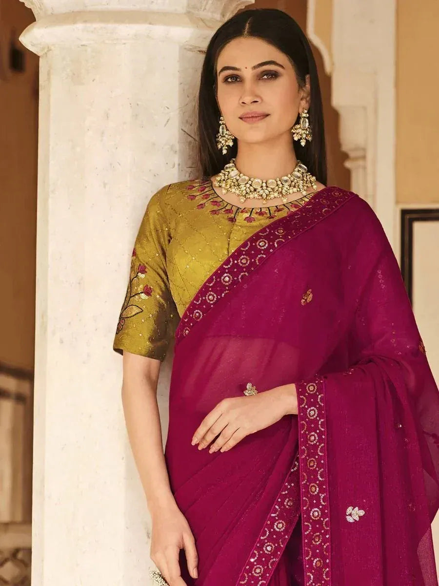 Elegant purple saree with gold embroidery, paired with a designer blouse and traditional jewelry for ethnic wear.