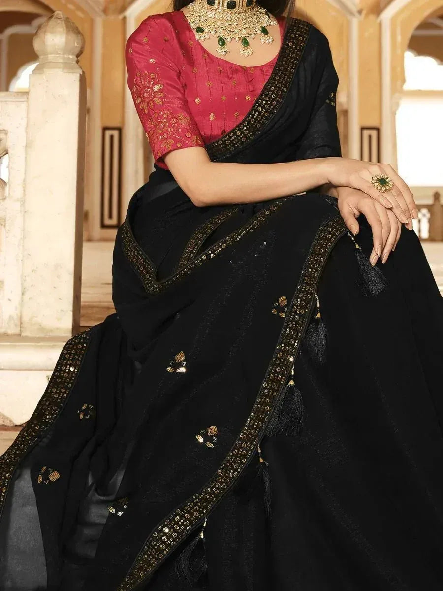 Black saree with gold embroidery and pink blouse, Indian ethnic wear with green jewelry