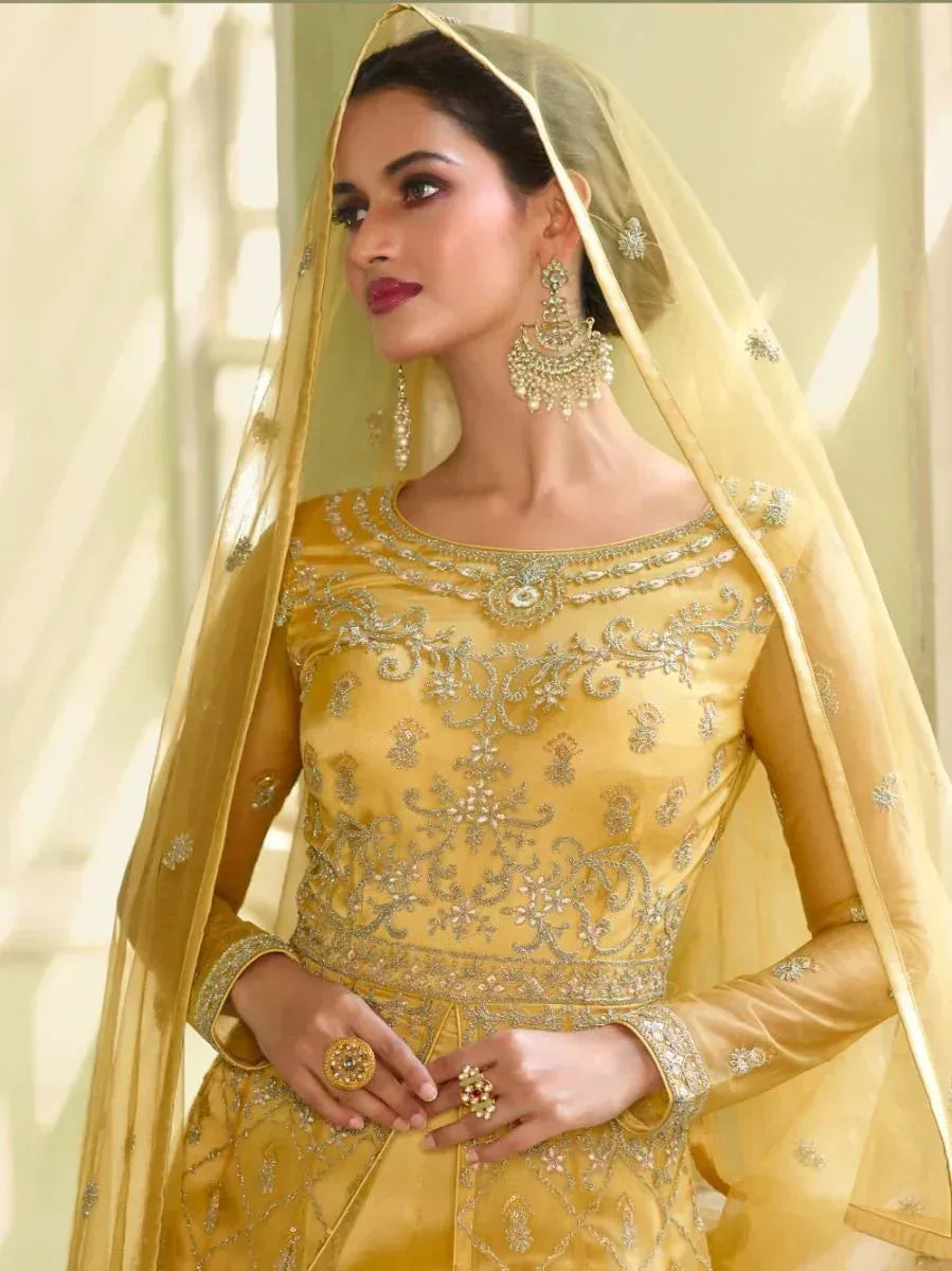 Elegant yellow embroidered lehenga choli with dupatta, perfect for Indian weddings and festive occasions