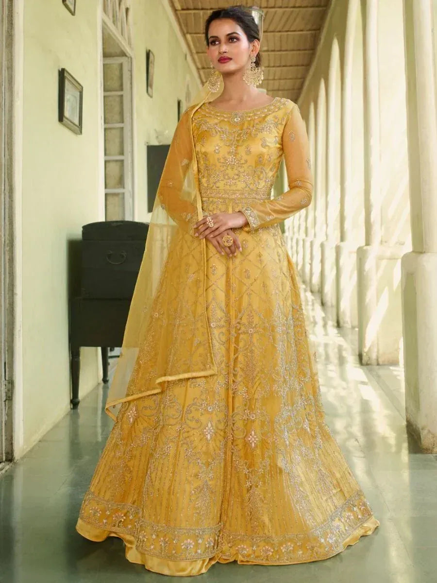 Elegant yellow embroidered lehenga choli with sheer dupatta for Indian ethnic wear