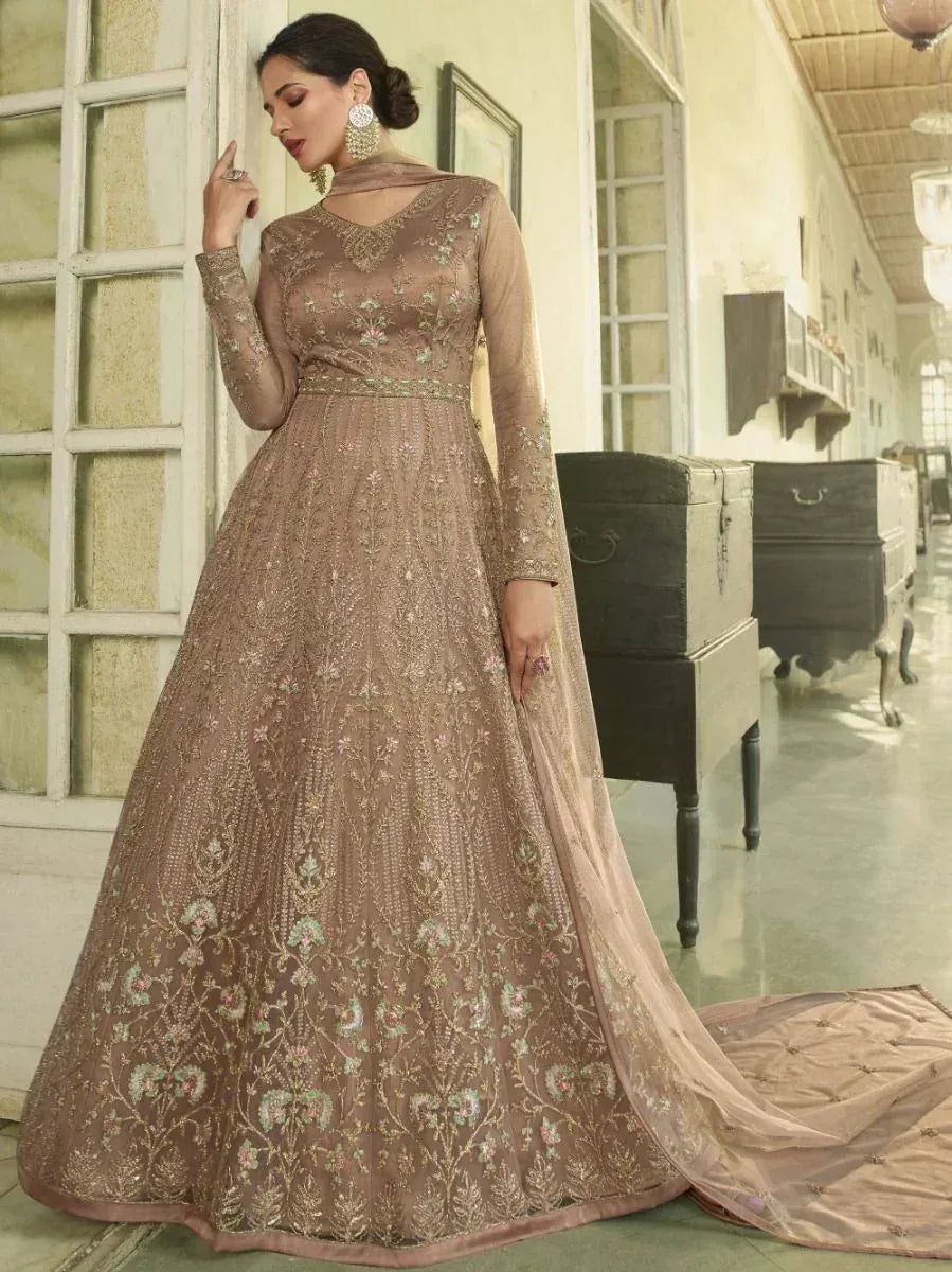 Elegant beige embroidered anarkali gown with floral motifs, perfect for Indian ethnic occasions